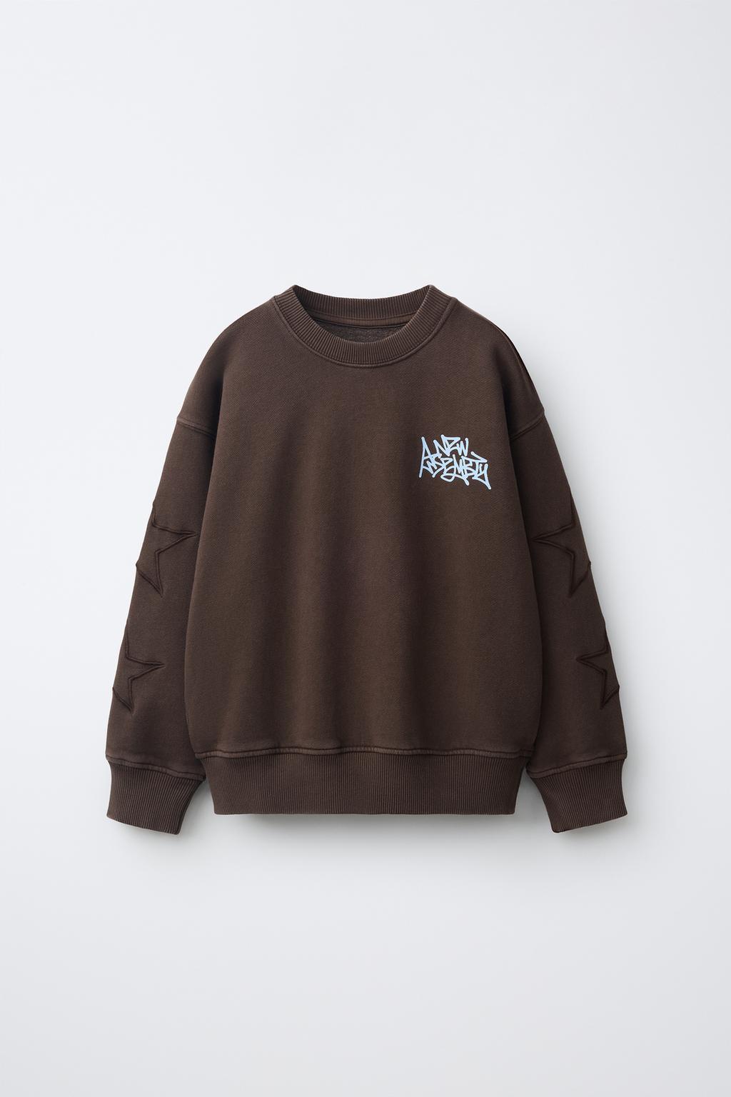 SWEATSHIRT WITH EMBROIDERED STARS AND SLOGAN