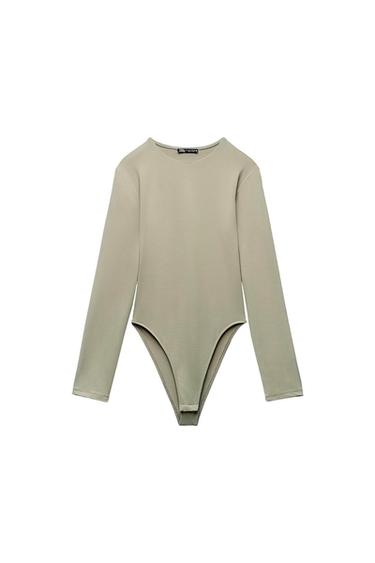 Long-sleeved gray bodysuit with a round neck on a white background. Visible tag on the neck with the text "ZARA".