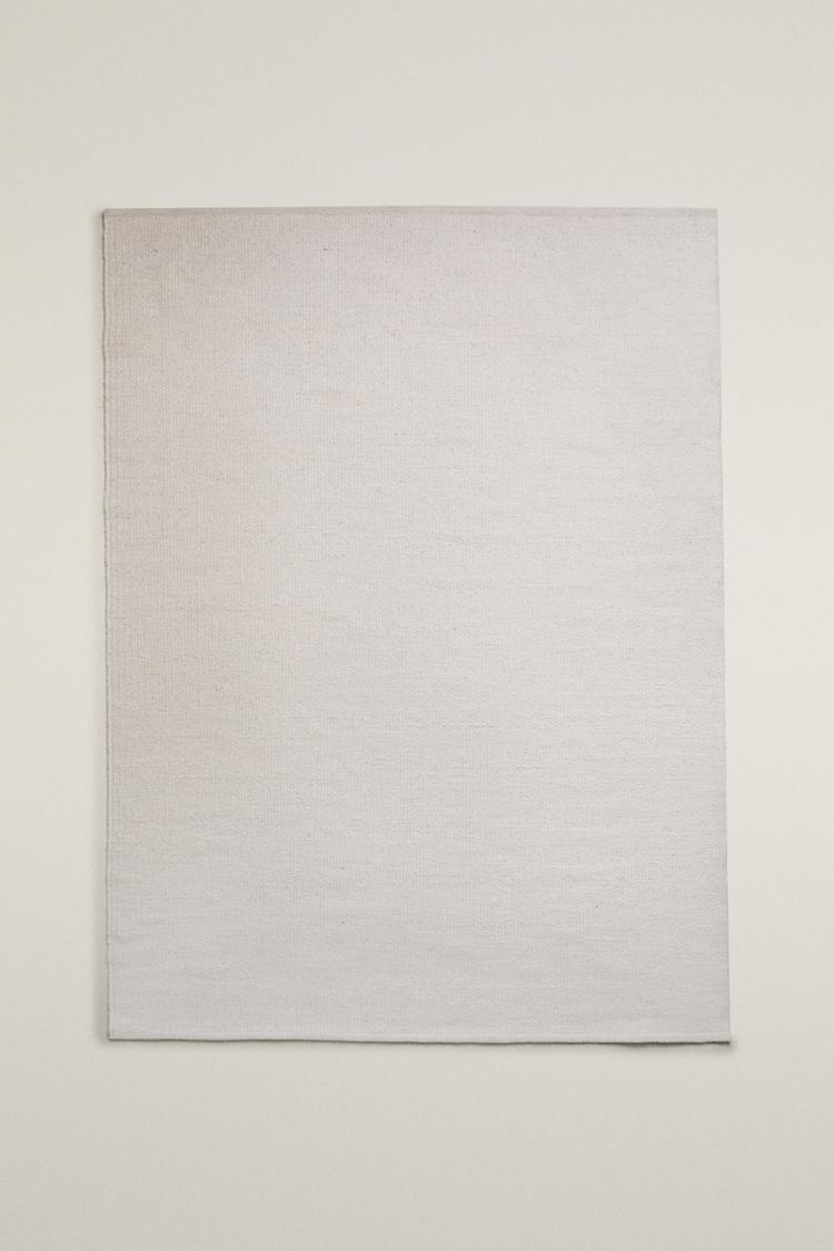 LIGHT-COLORED WOOL AREA RUG — Ecru