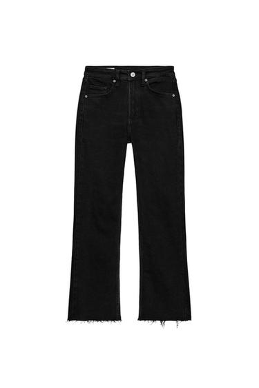 Front view of black pants with front and back pockets, button and zipper closure, frayed hems.