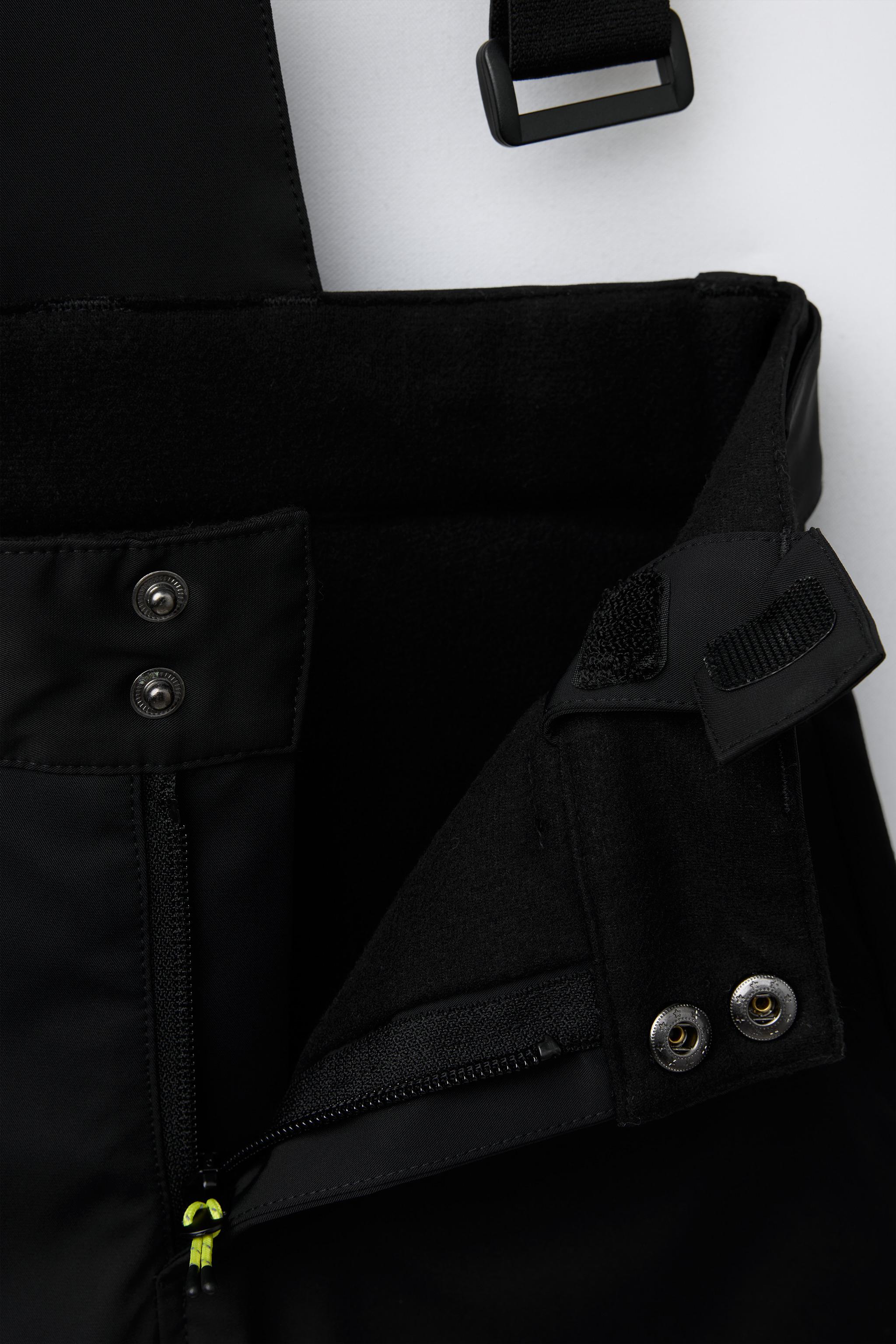 WATER RESISTANT AND WINDPROOF STRAP PANTS RECCO® SYSTEM SKI COLLECTION