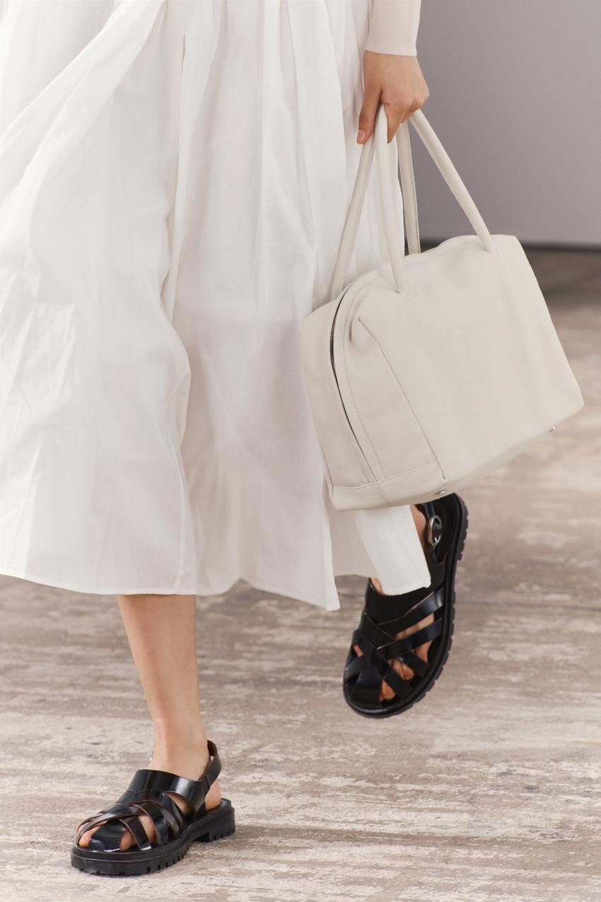 Zara black leather cage fisherman sandals with criss-cross straps and buckle fastening.