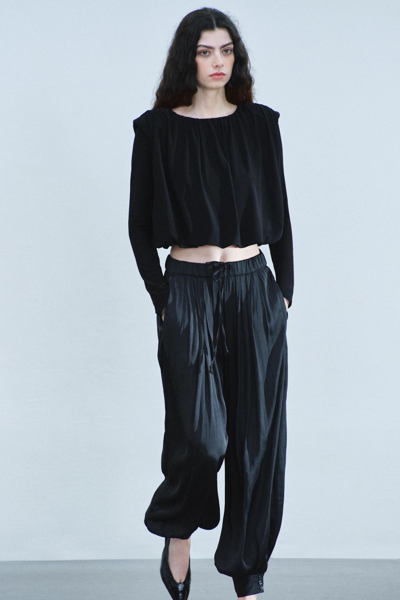 DRAPED SHOULDER-PAD TOP — Black