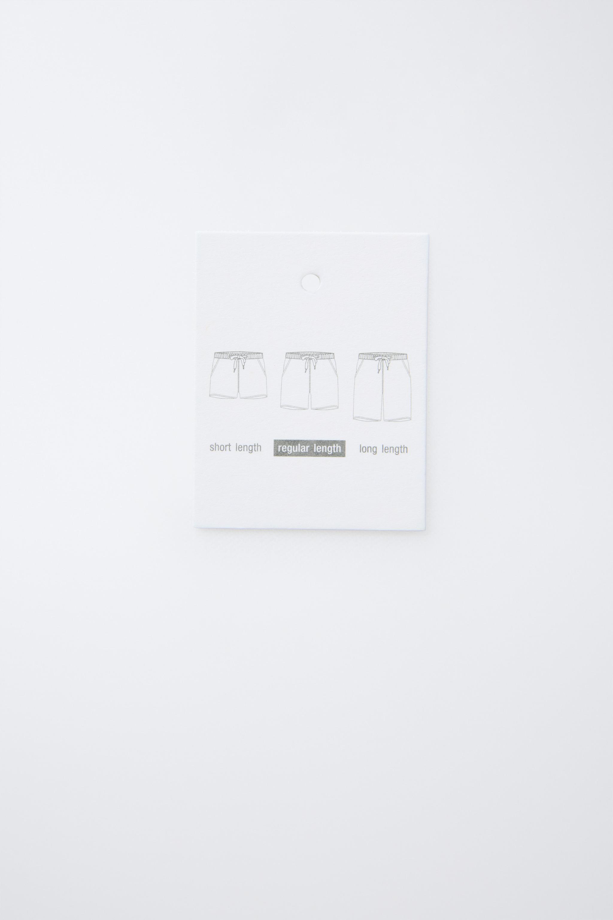 6-14 YEARS / LABEL SWIM SHORTS