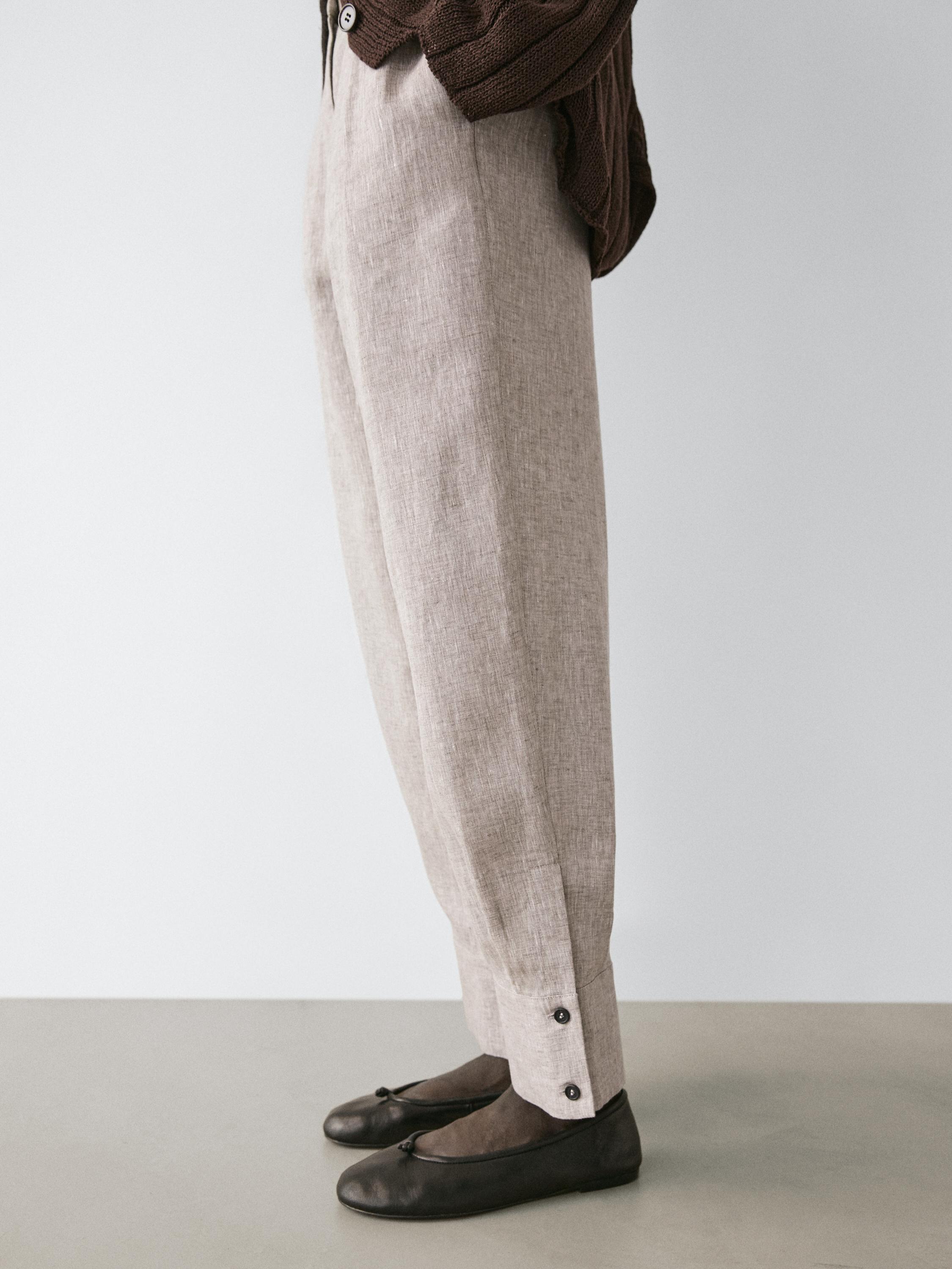 Suit trousers with buckle detail