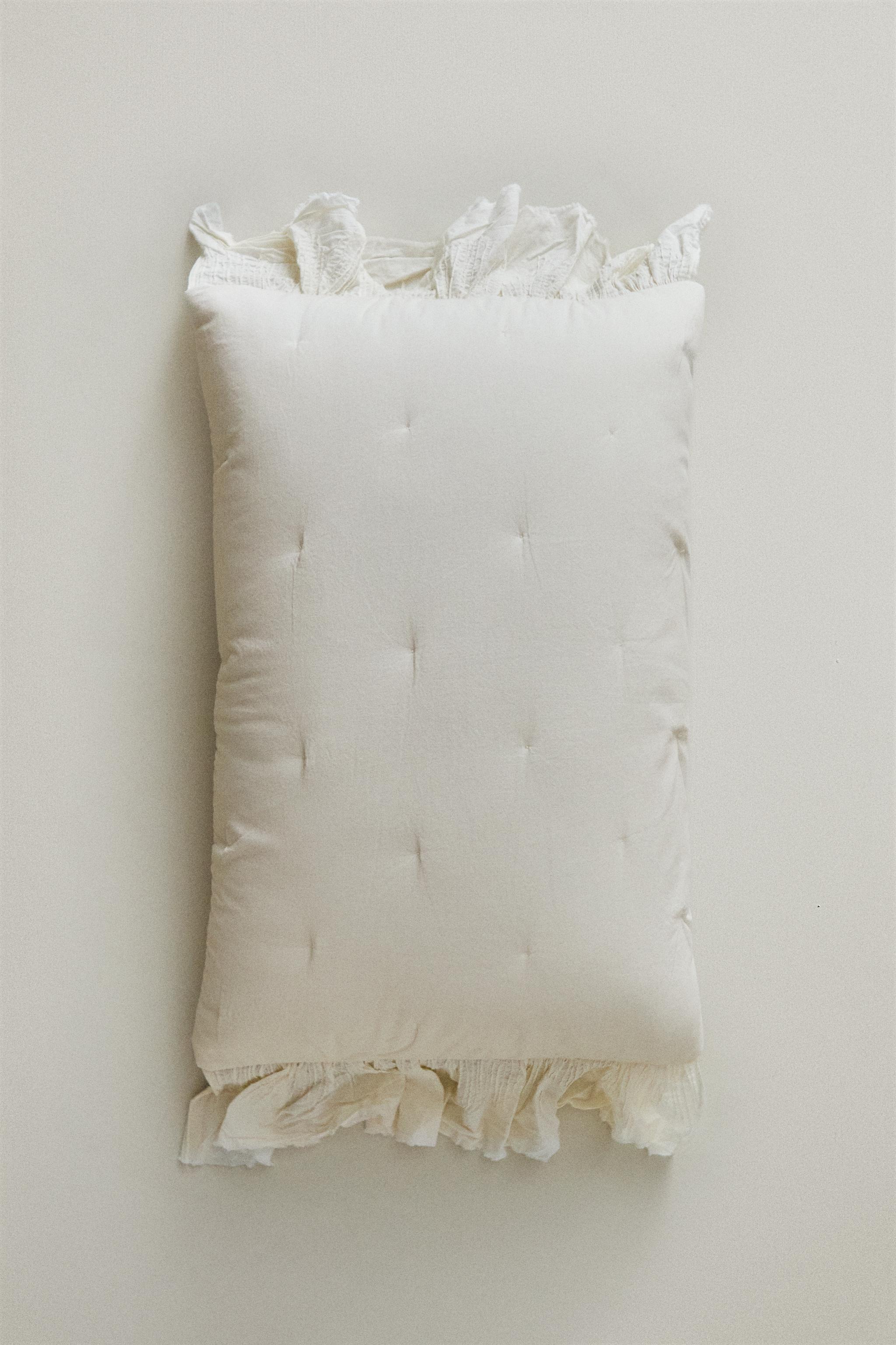 COTTON QUILTED CUSHION COVER WITH RUFFLE TRIM — Oyster-white