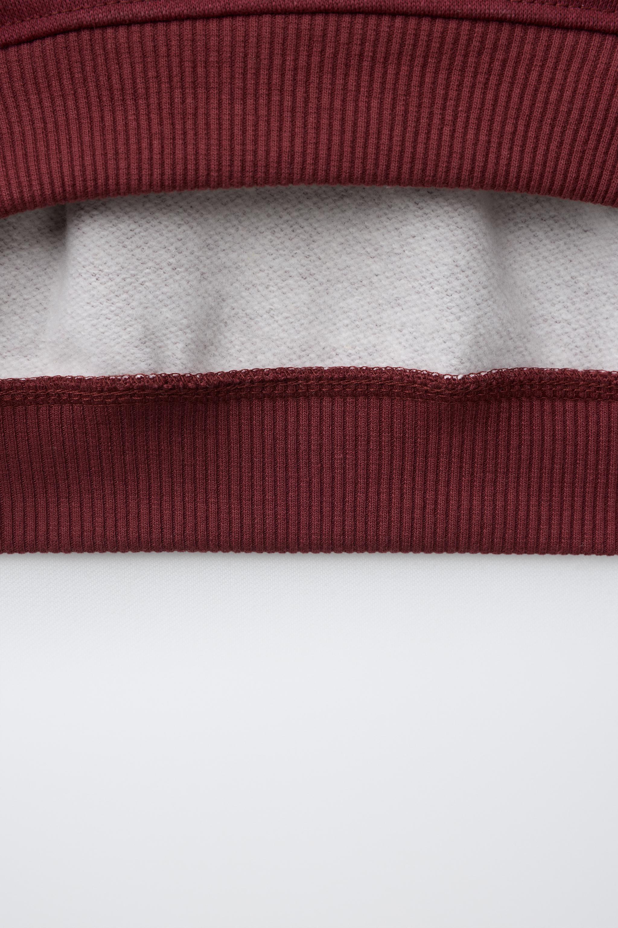 STRIPED VARSITY SWEATSHIRT