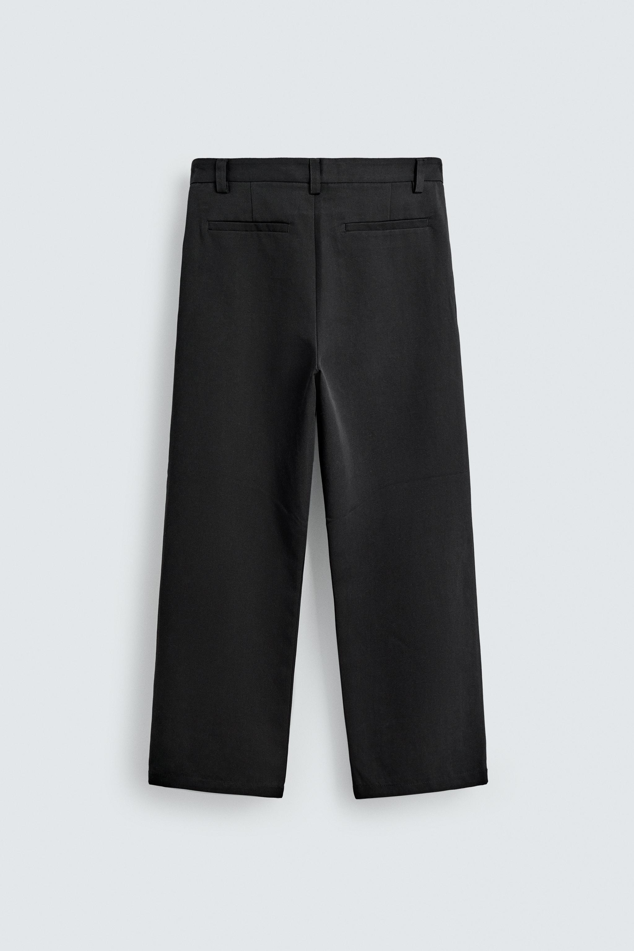 PANTALON COUPE LARGE À PLIS
