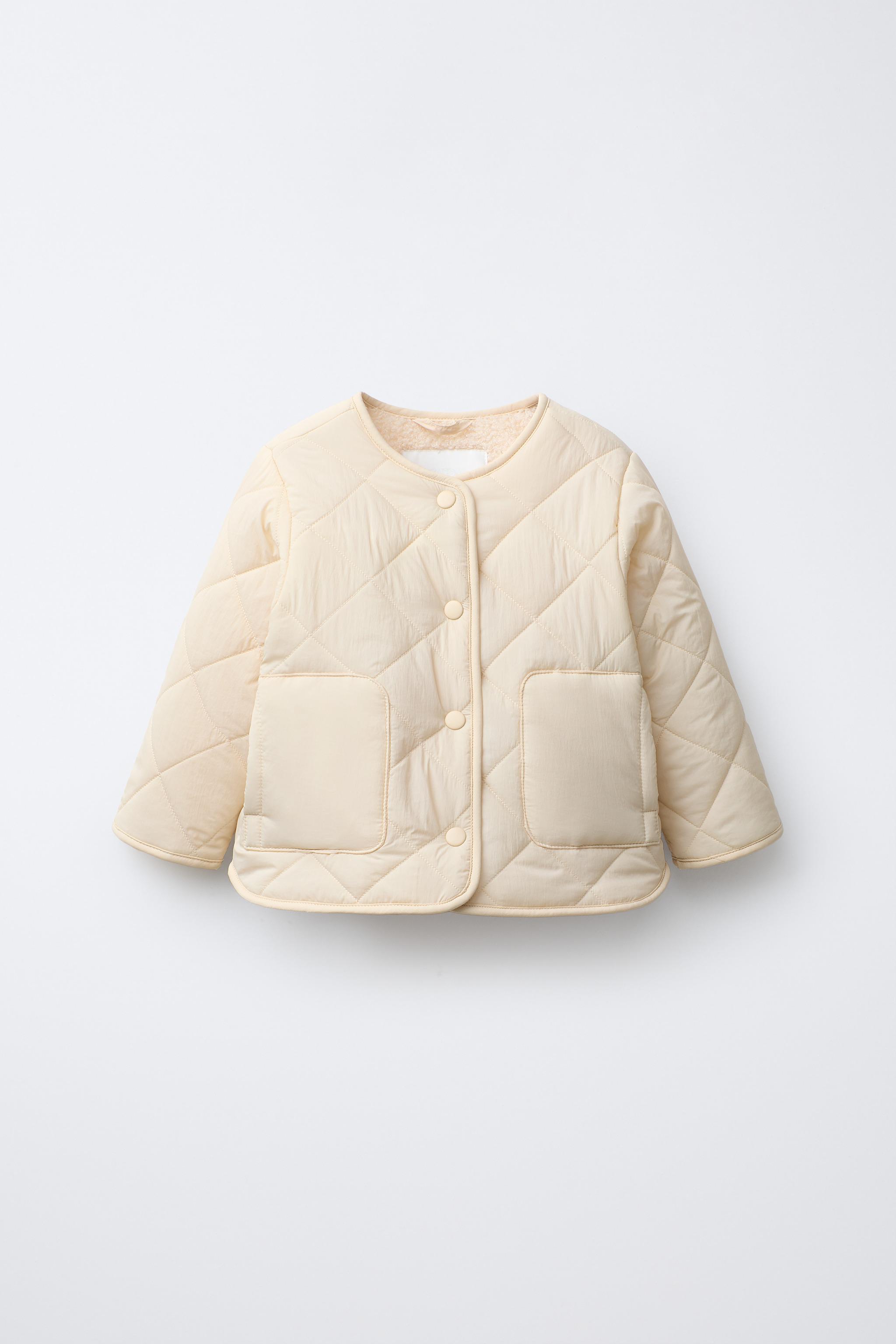 WATER REPELLENT NYLON FAUX SHEARLING JACKET