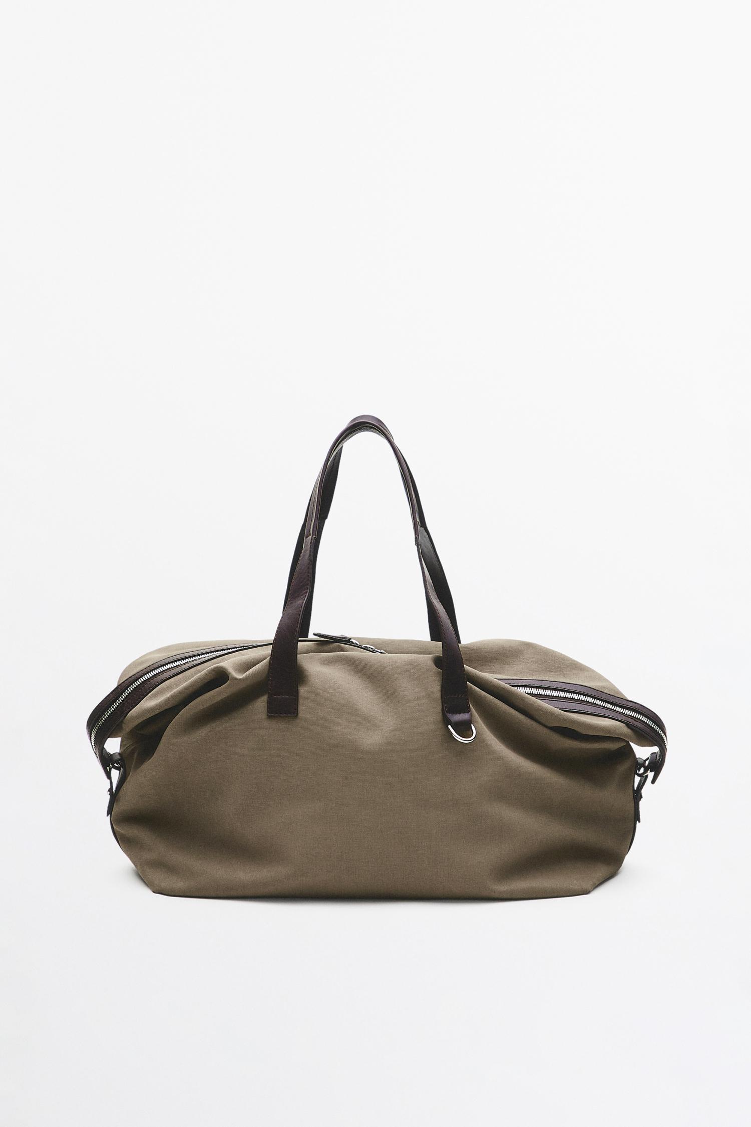 Nappa leather detail travel bag — Black gold