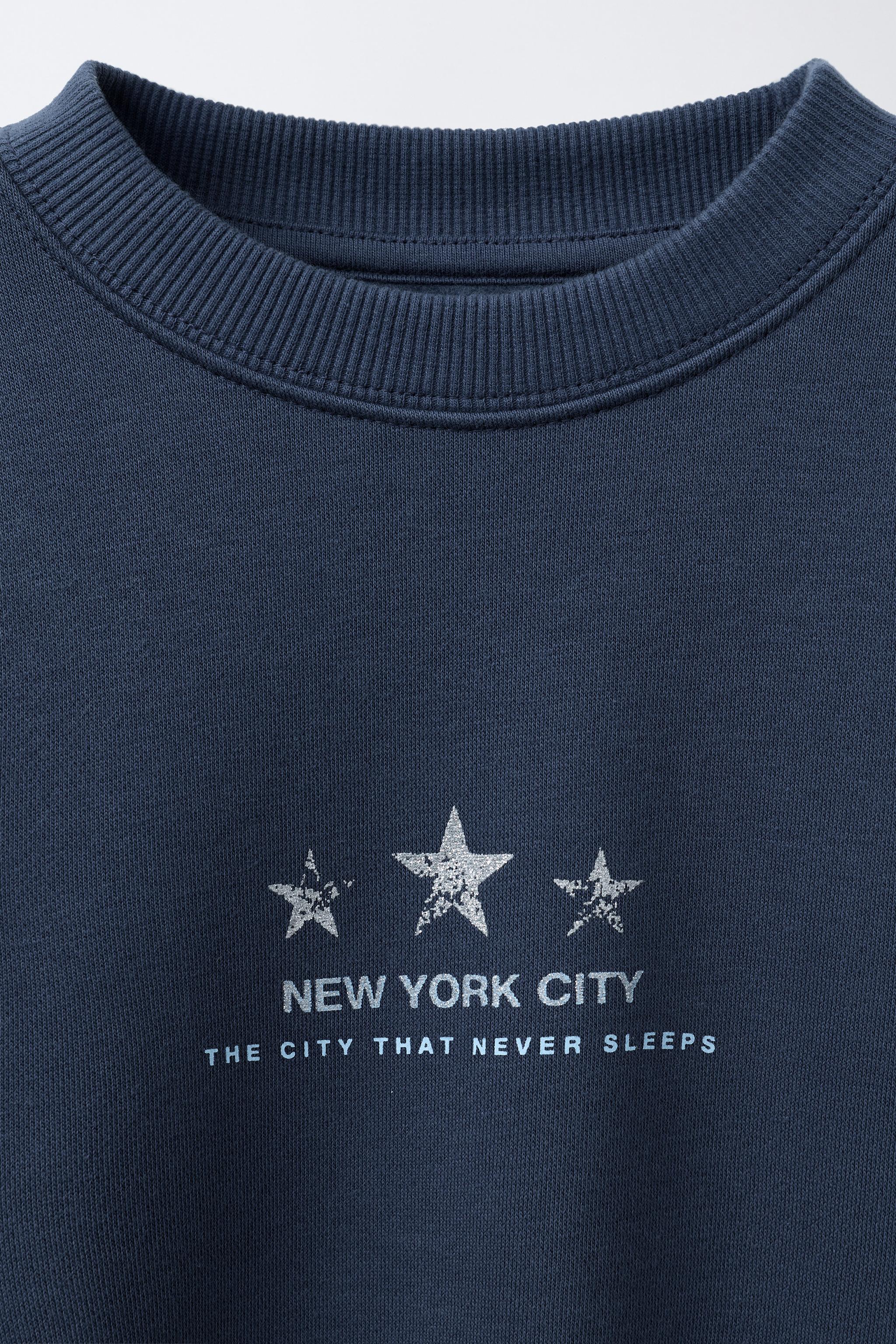 SPARKLY STAR PRINT SWEATSHIRT