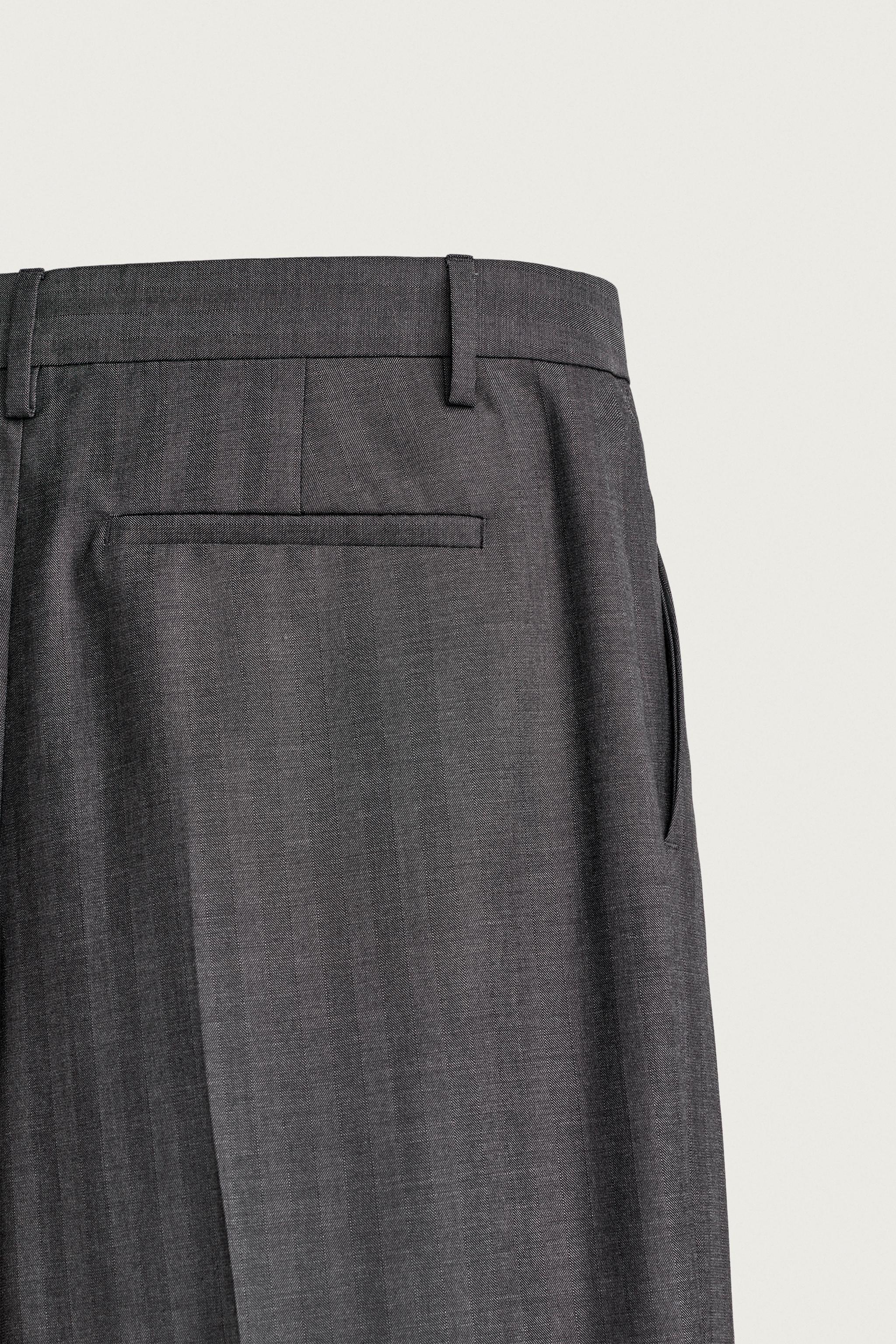 STRIPED PLEATED RELAXED FIT PANTS