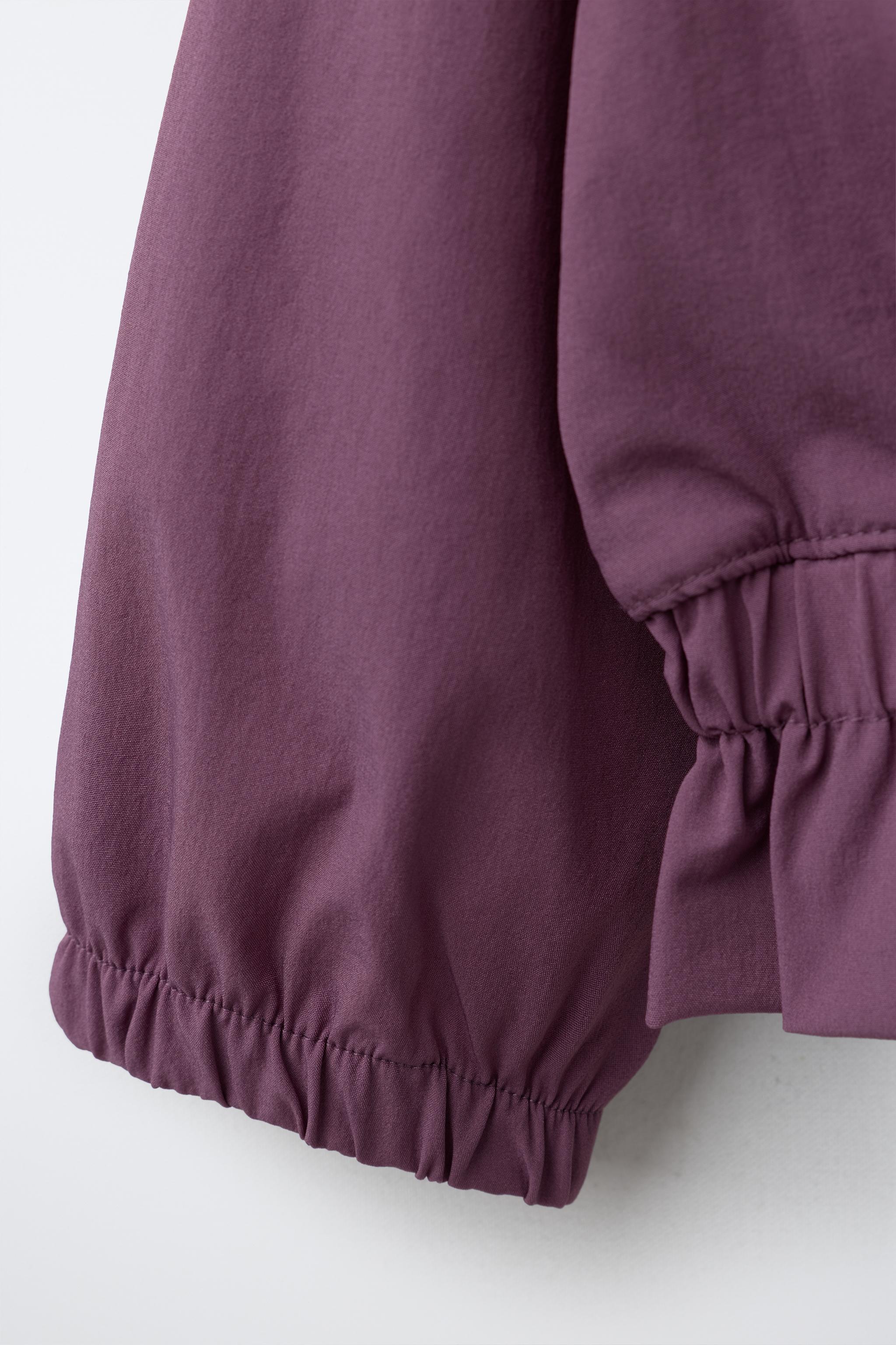 VESTE TECHNIQUE À VOLANT