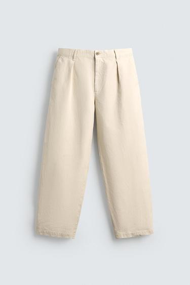 PANTALONS RELAXED FIT AMB PLECS LIMITED EDITION - Blanc trencat de Zara