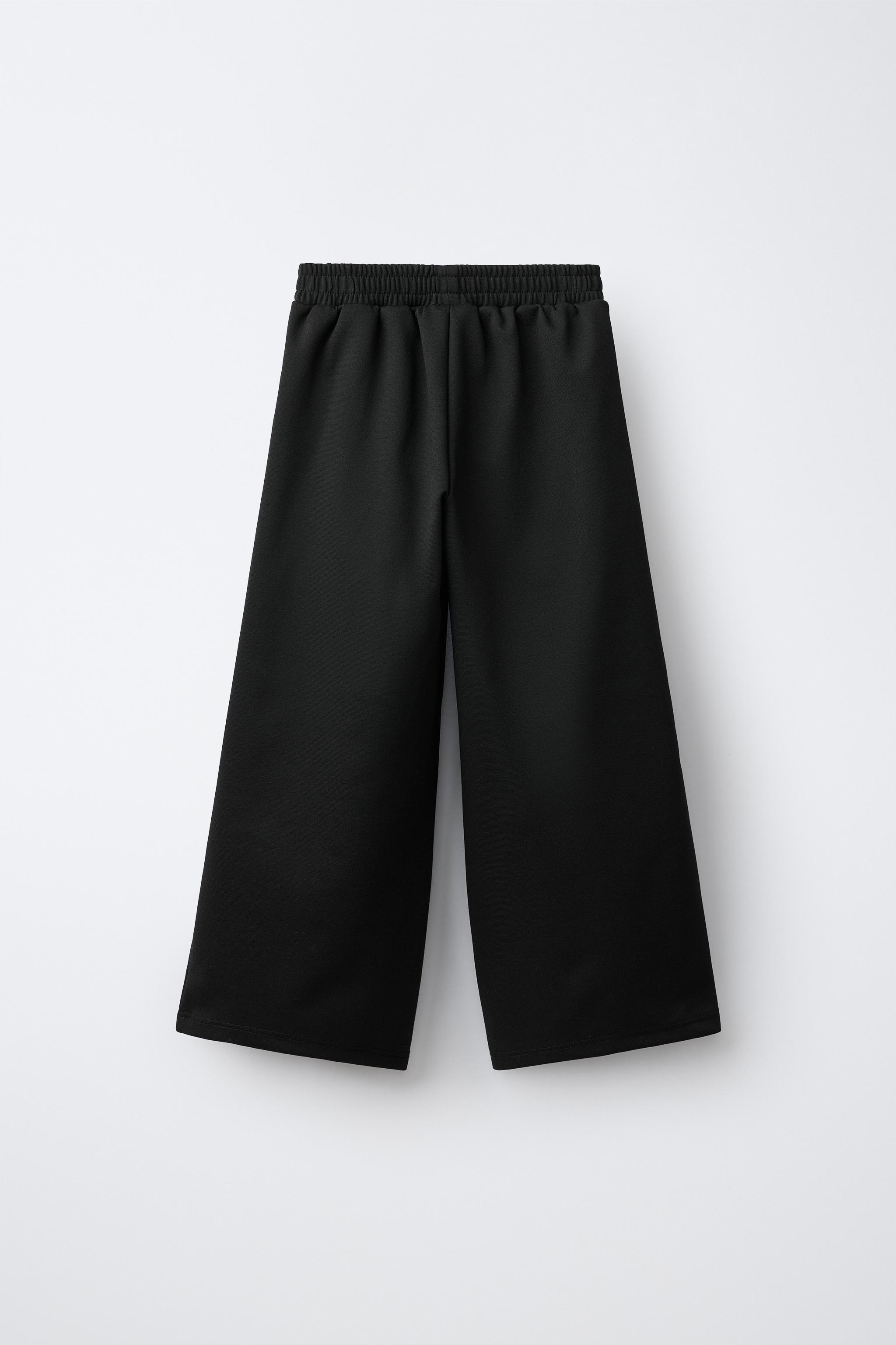 INTERLOCK PLEATED WIDE-LEG PANTS
