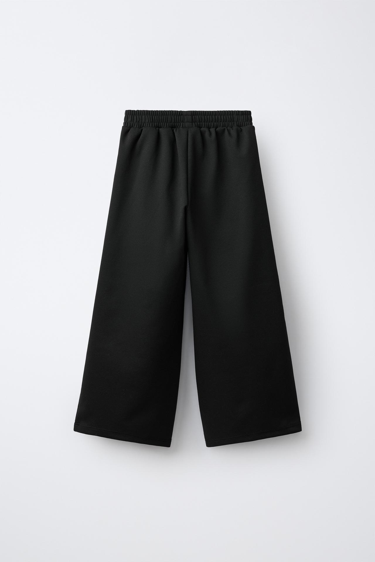 INTERLOCK PLEATED WIDE-LEG PANTS — Black