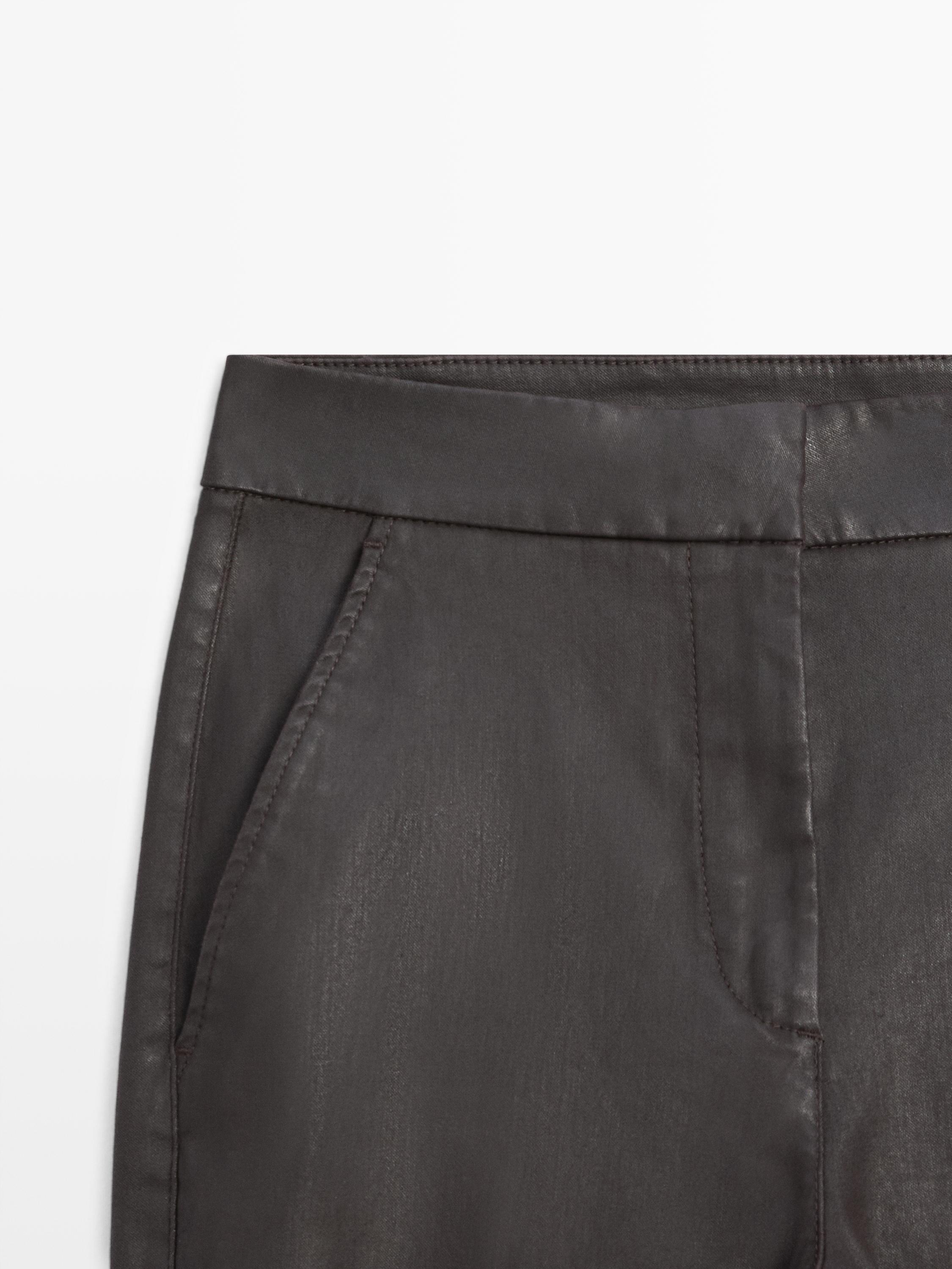 Waxed flare fit trousers
