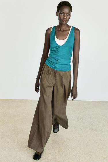 Pantalón fluido pliegues ancho técnico - Negro oro de Zara