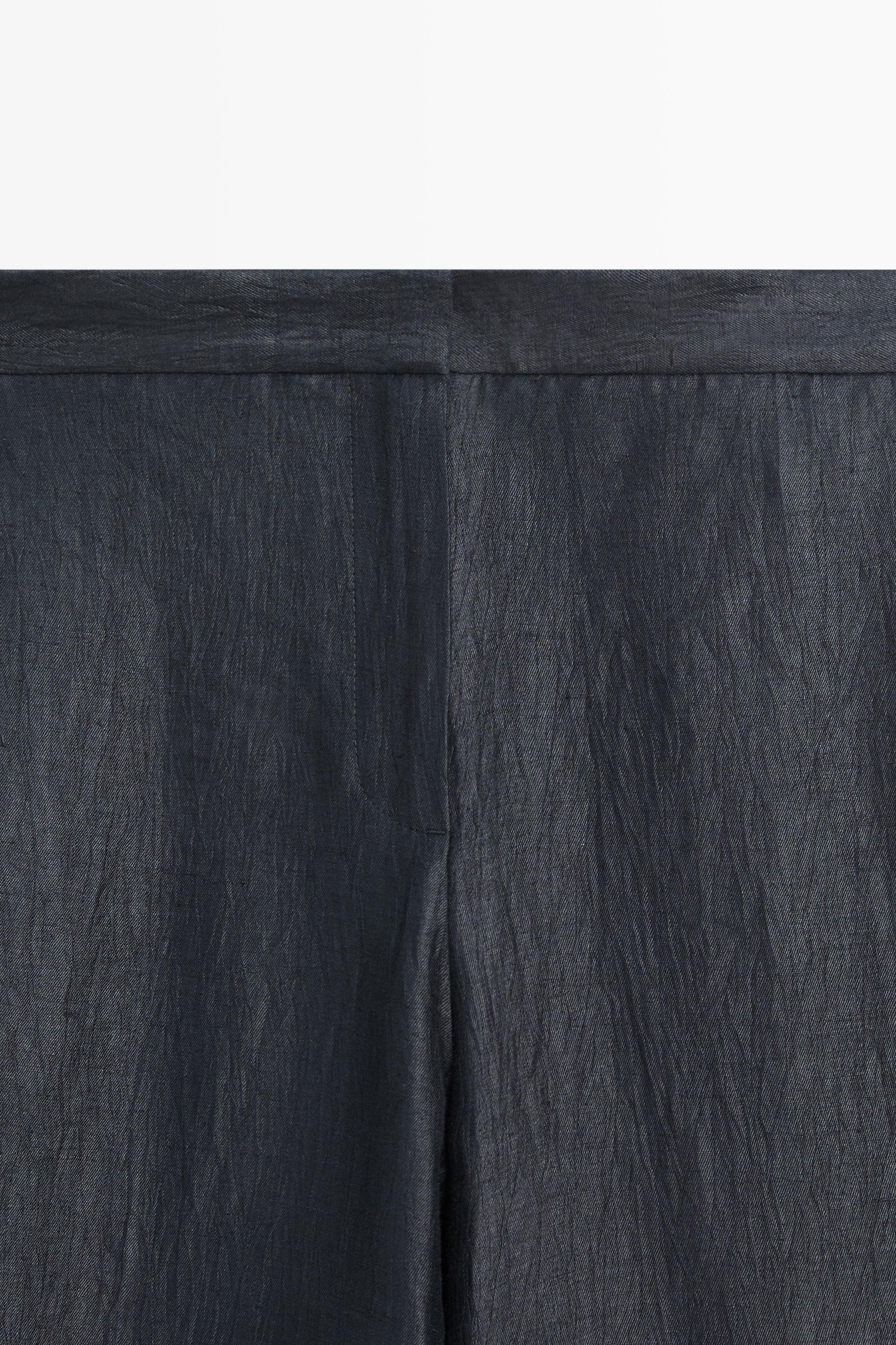 Trousers with gathered hems