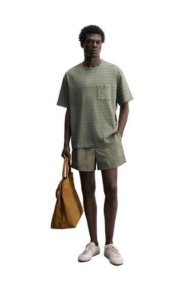 ЖУЫЛҒАН ЖОЛАҚТЫ ҚАЛТАЛЫ ФУТБОЛКА - Ақшыл сары / Жасыл Zara компаниясынан
