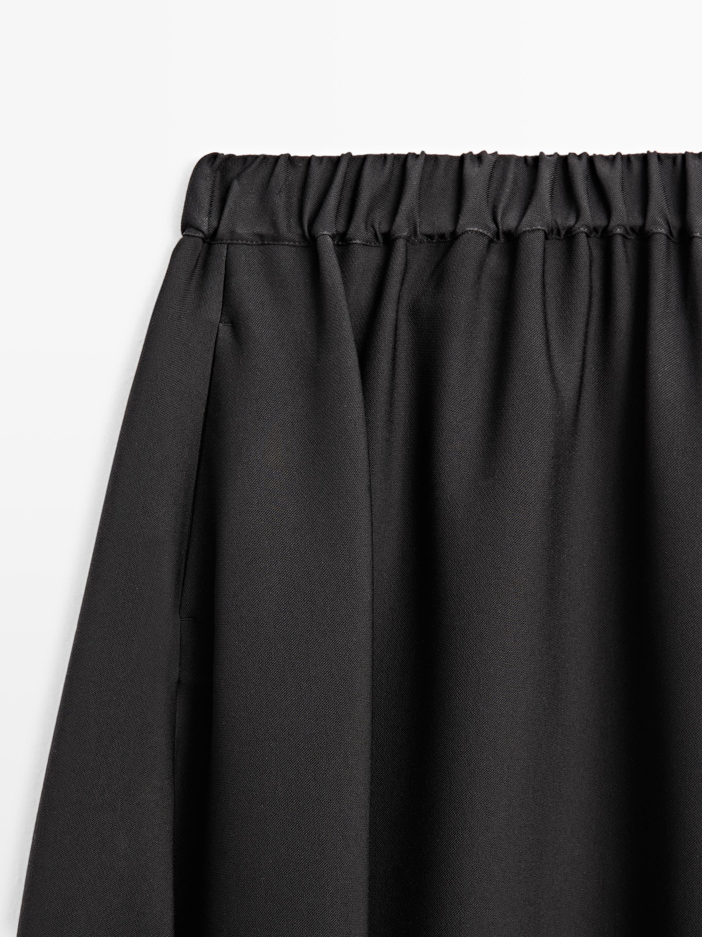 Jupe midi évasée à taille élastique