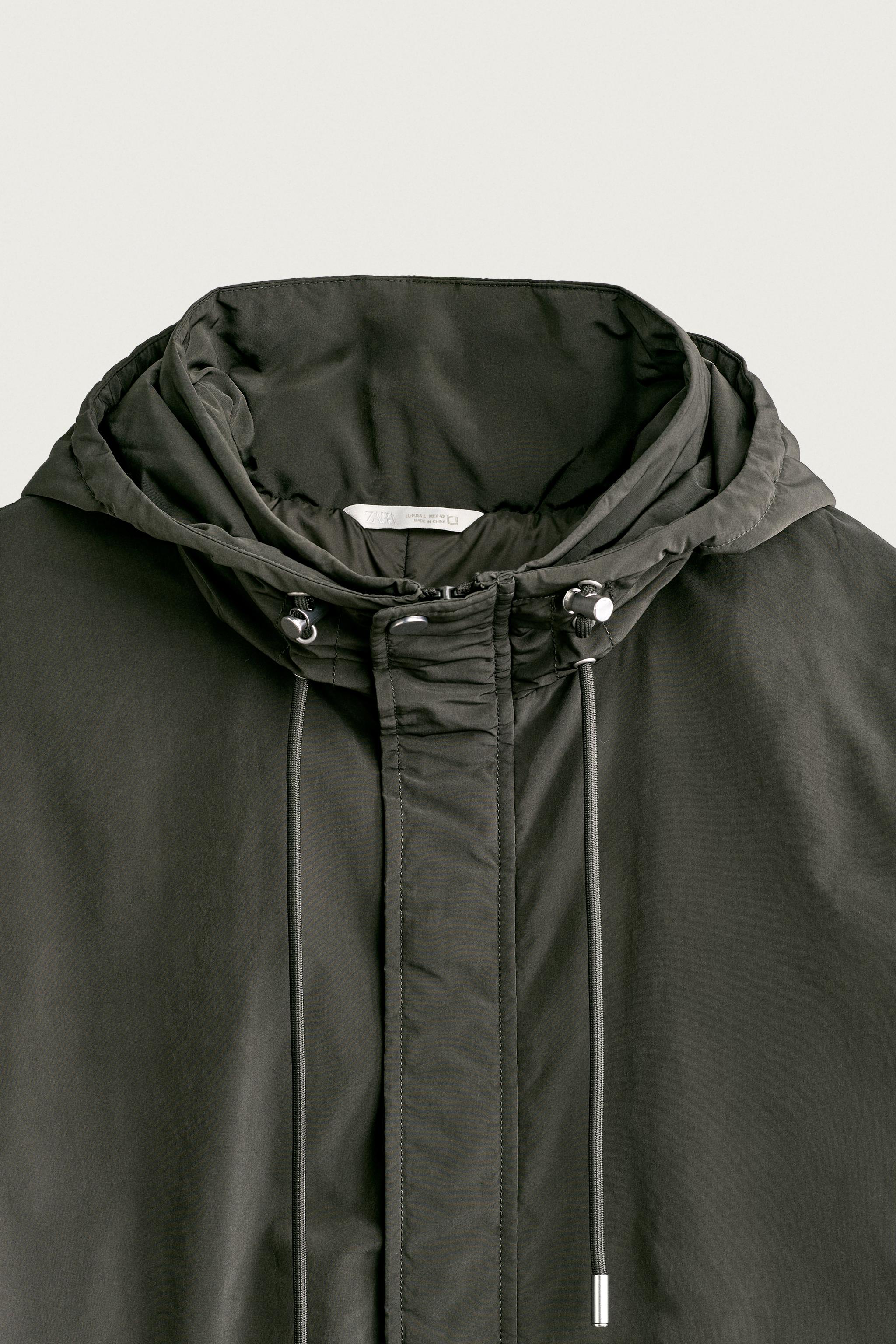 BLOUSON TECHNIQUE À CAPUCHE DÉPERLANT