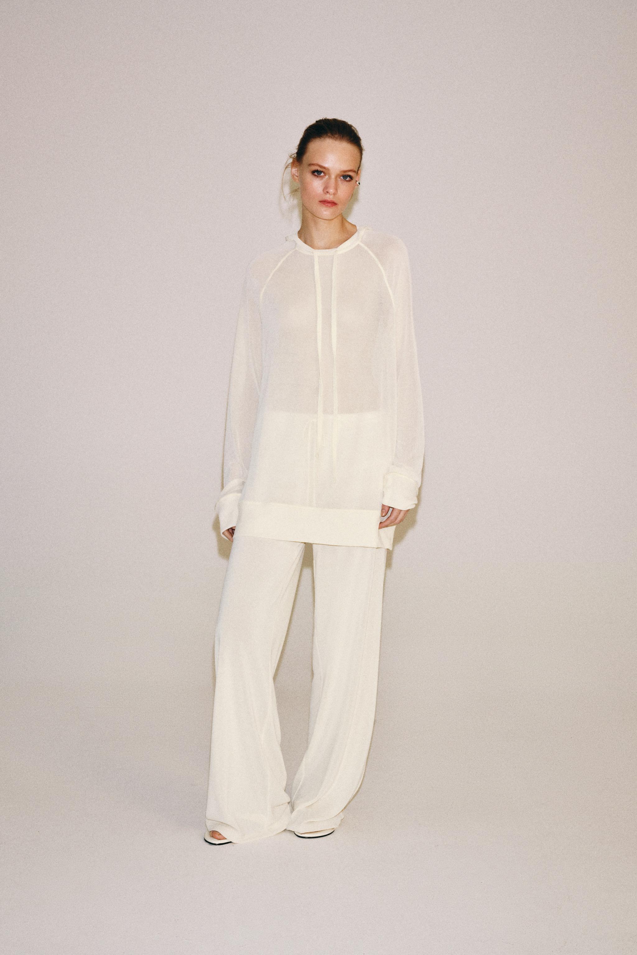 SEMI-SHEER FLOWY SWEATSHIRT