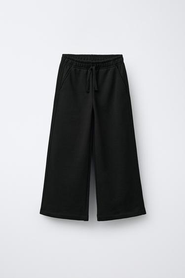 PANTALON EN MOLLETON À JAMBES LARGES ÉTOILES - Noir de Zara - Image 0