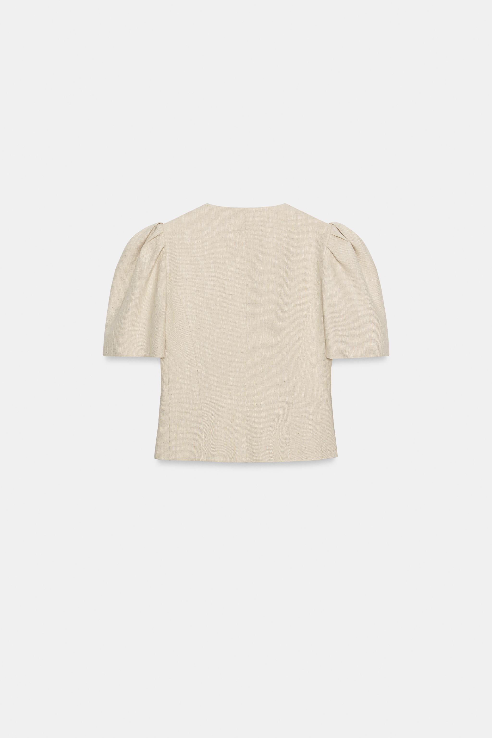 VESTE À MANCHES COURTES BOUFFANTES