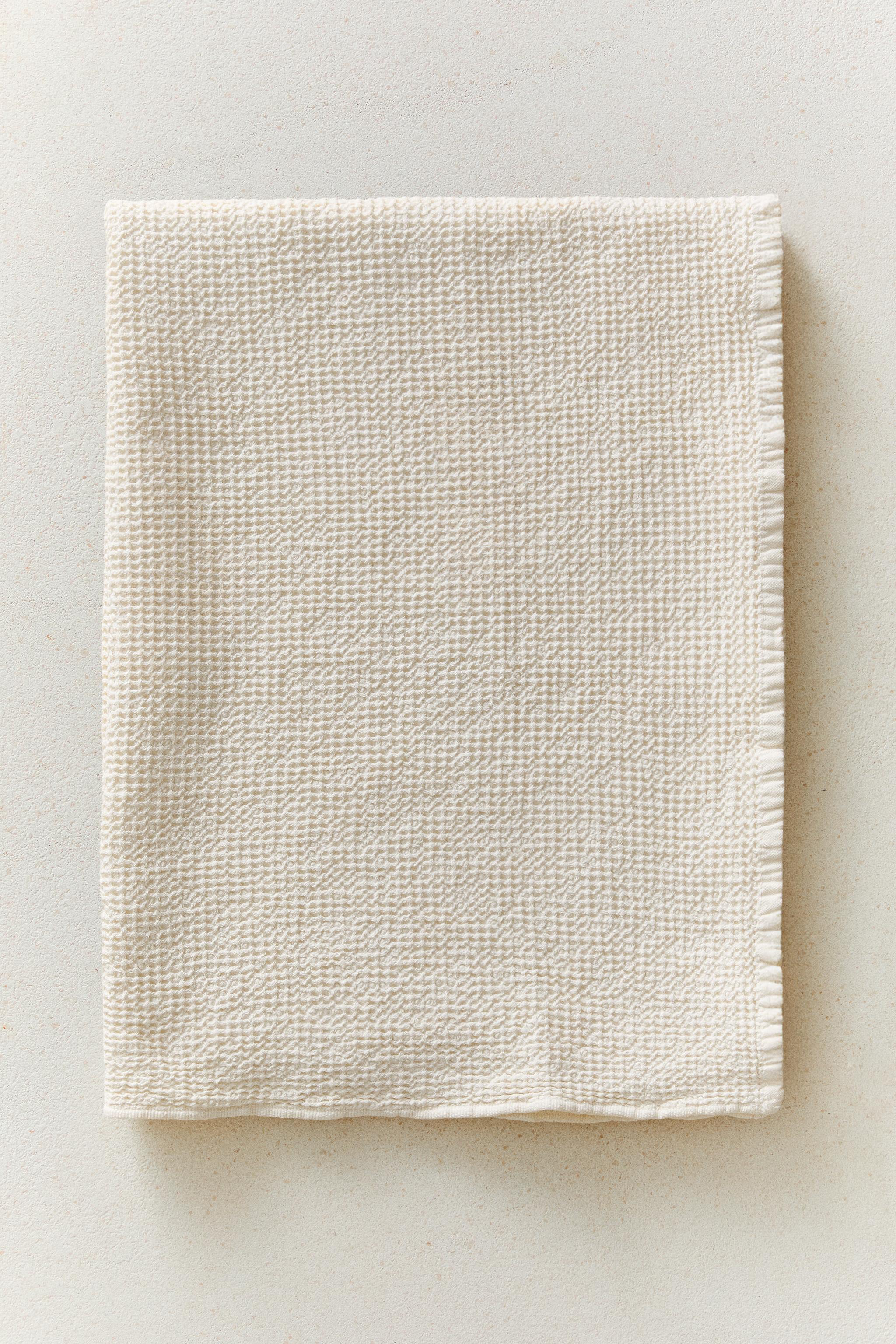 WAFFLE-KNIT TEXTURED BATH TOWEL — Ivory
