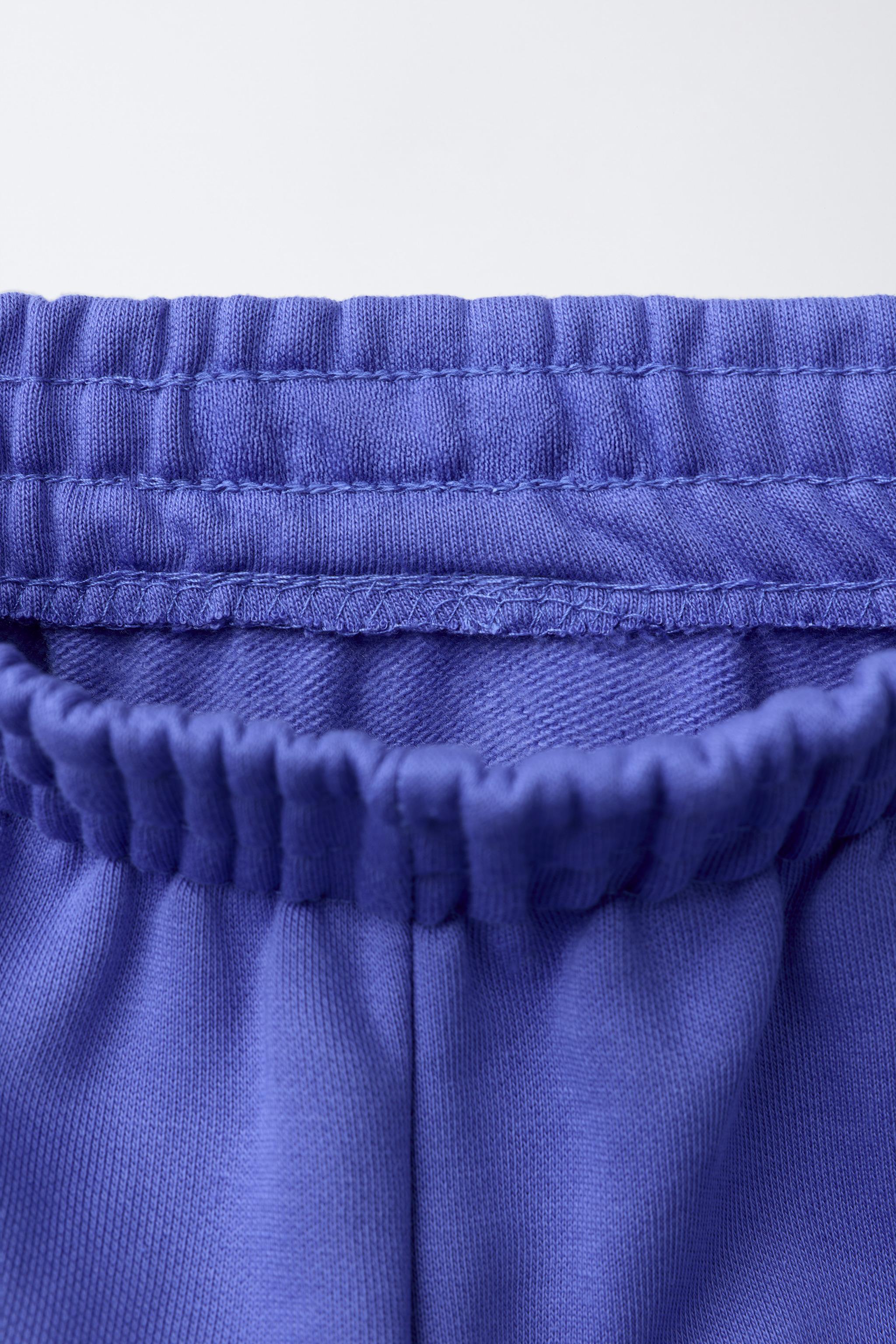 PANTALON JOGGER EN MOLLETON AVEC TEXTE