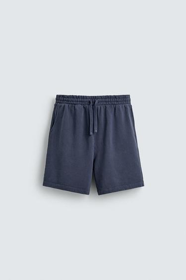 BERMUDES JOGGER BÀSIQUES RENTADES - Blau de Zara