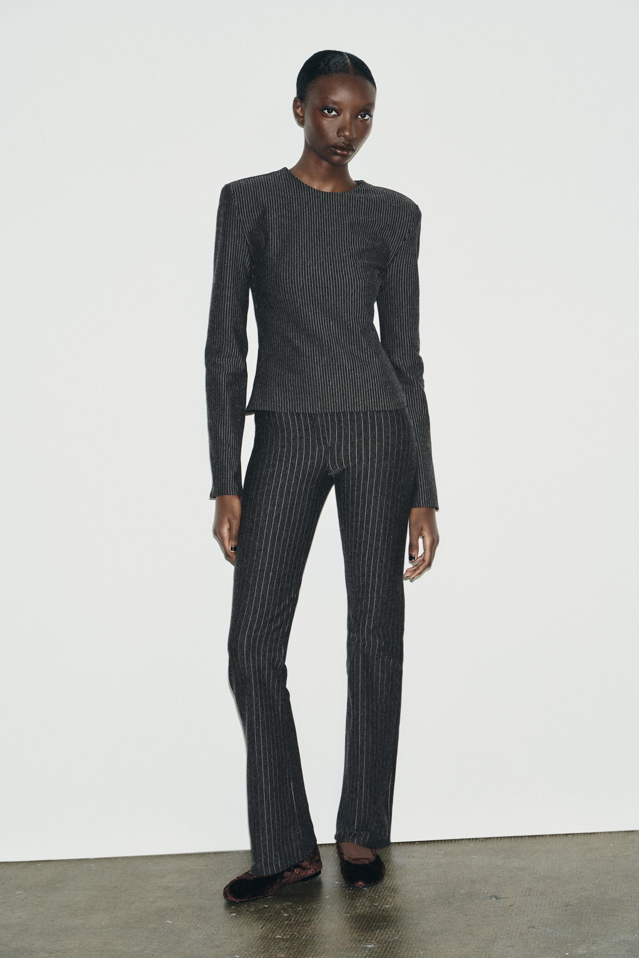 PINSTRIPED SHOULDER PAD TOP