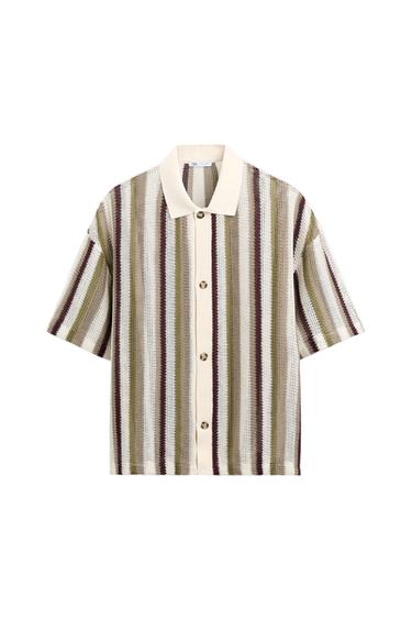 Short-sleeved shirt with vertical stripes in beige, green, and brown tones. Classic collar and front button closure.