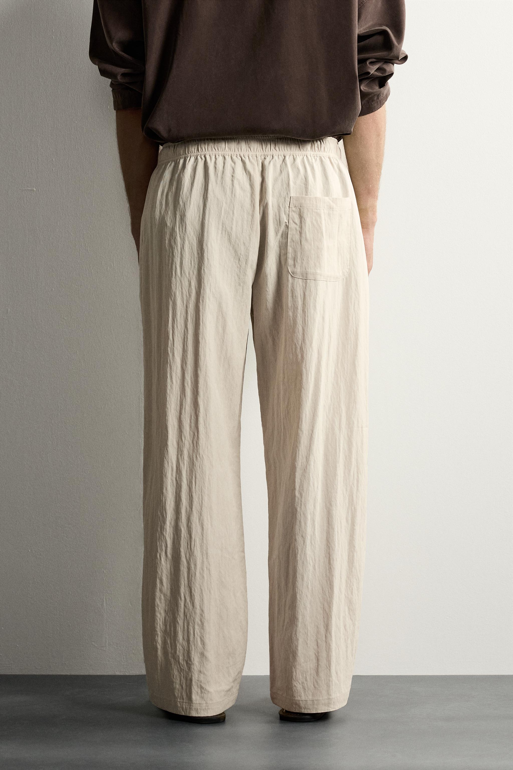 CRINKLED EFFECT TECHNICAL RELAXED FIT PANTS