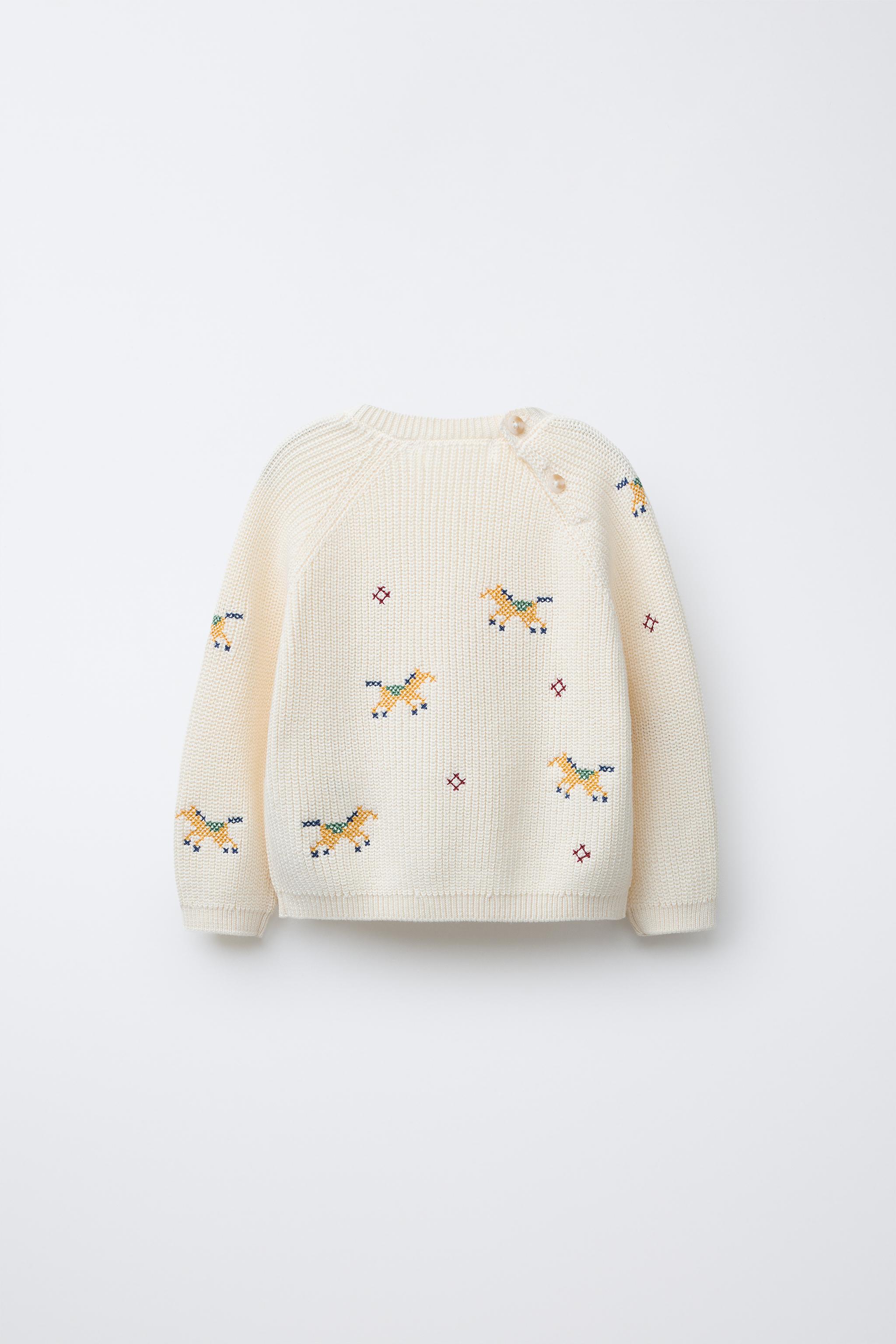 PULL EN MAILLE DÉTAILS POINT DE CROIX