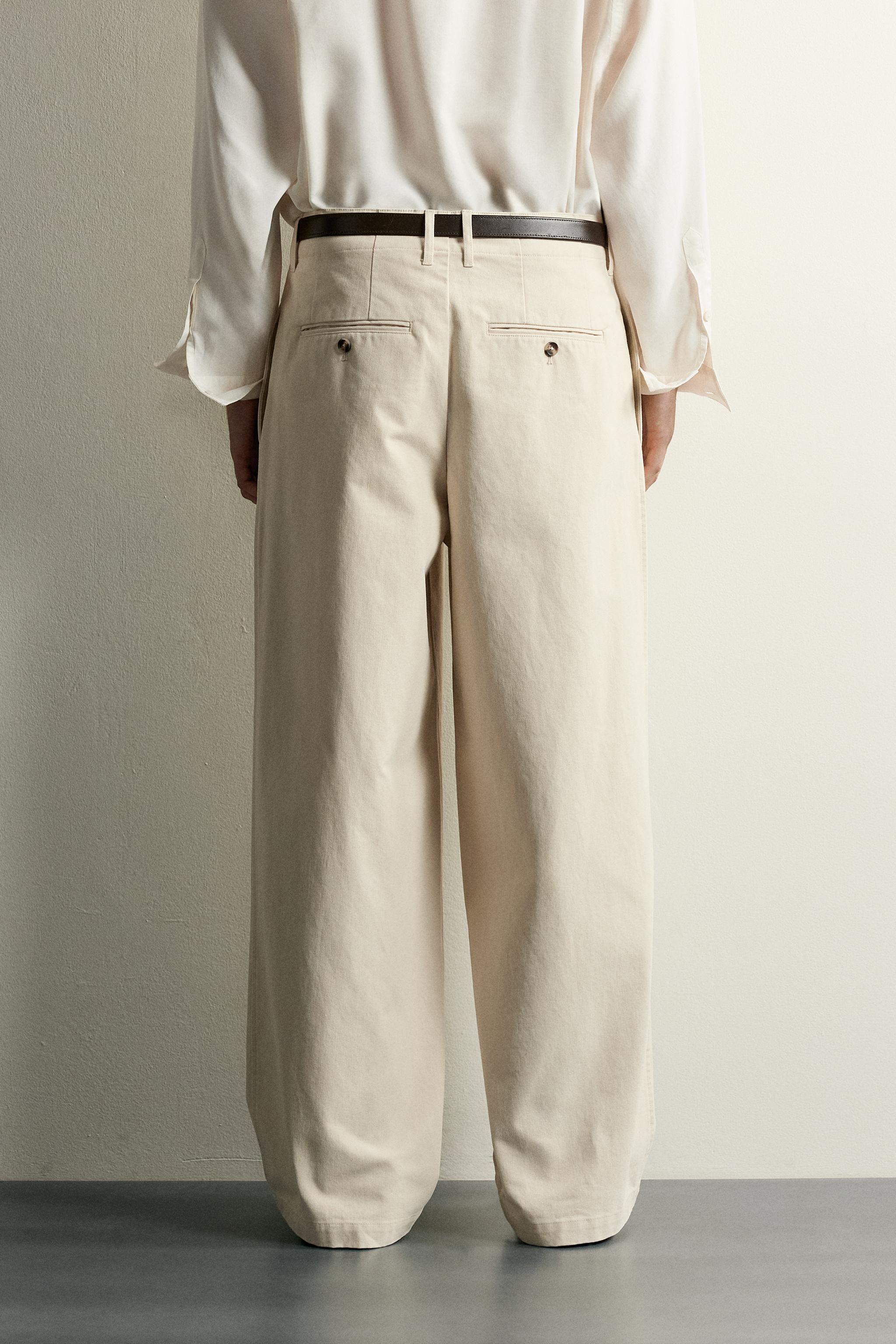 RELAXED FIT PLEATED PANTS
