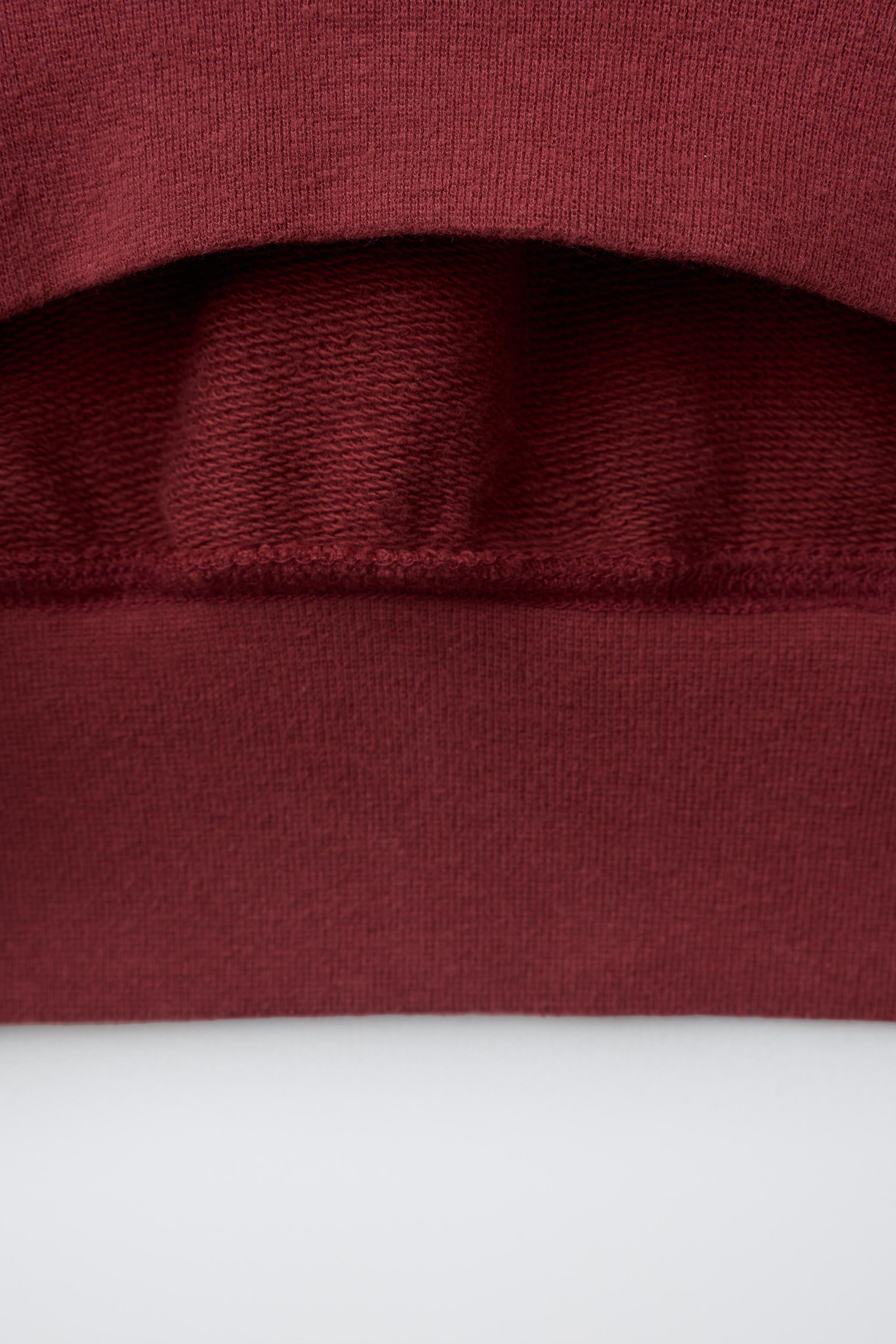 SWEAT ZIPPÉ À INSCRIPTION IMPRIMÉE
