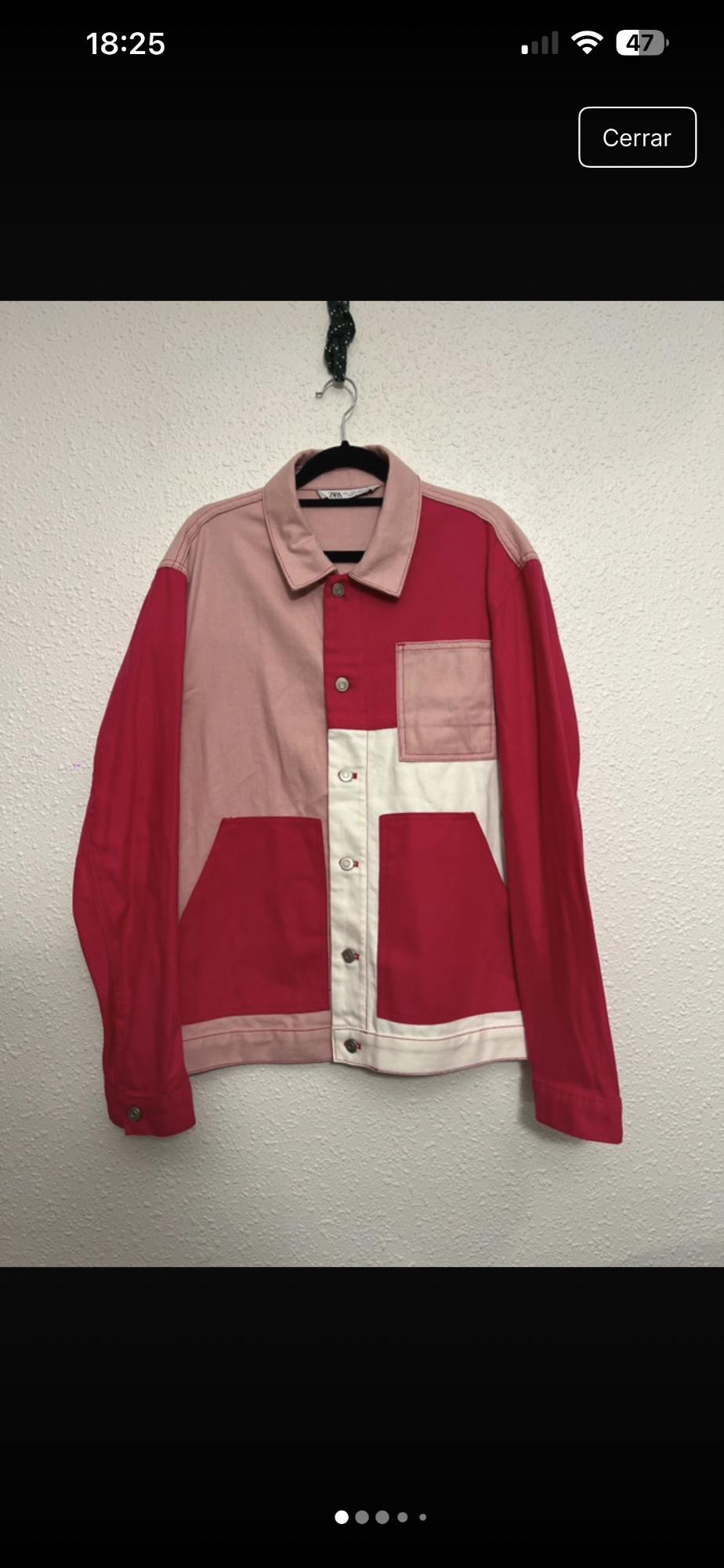 Hung jacket with colour block design in pink and red tones, with large pockets and front buttons. White background.