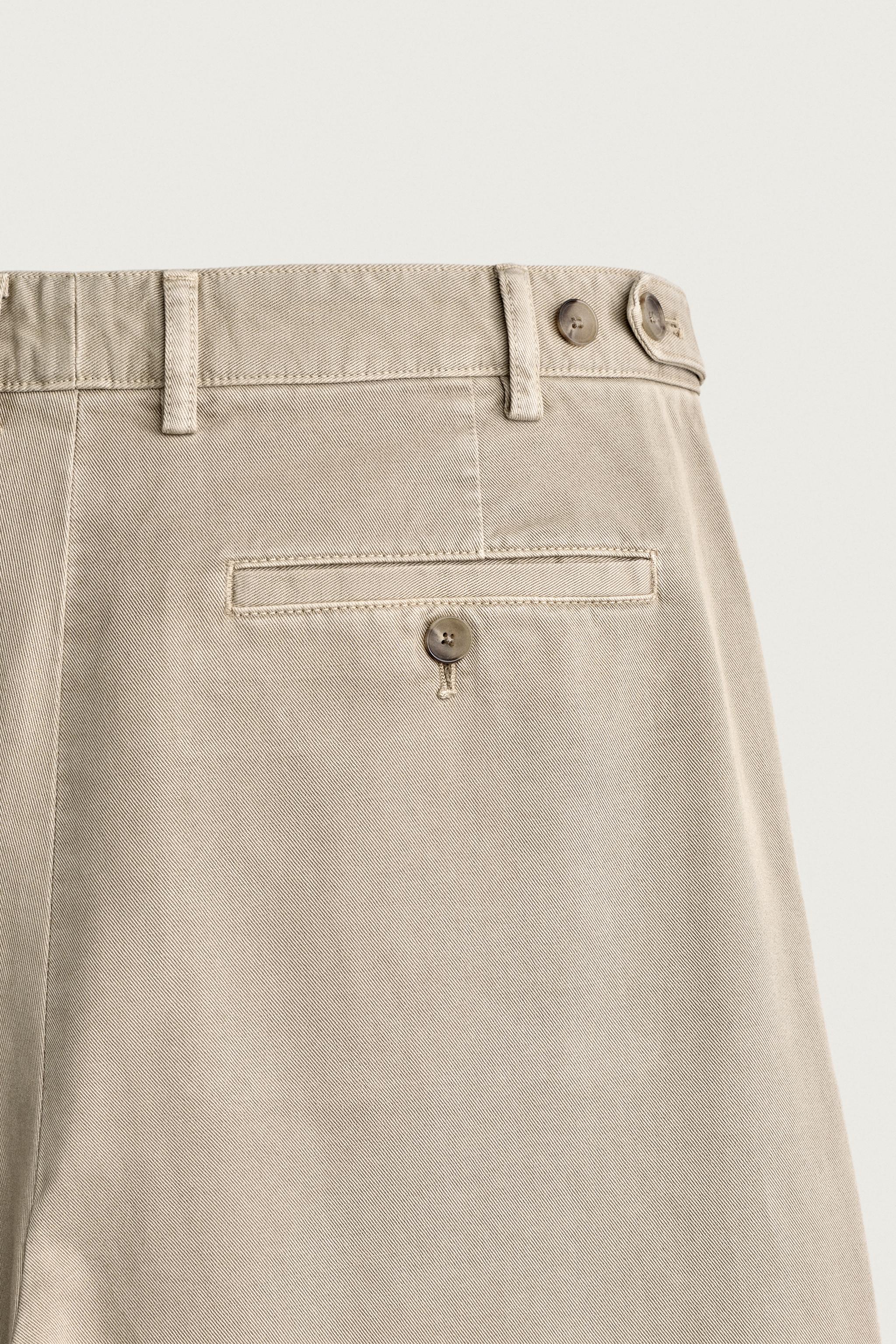 RELAXED FIT PLEATED CHINO PANTS