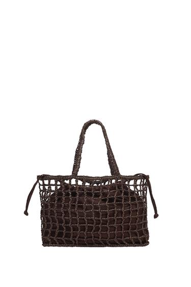 "Front view of a brown handbag with a net design and braided handles."