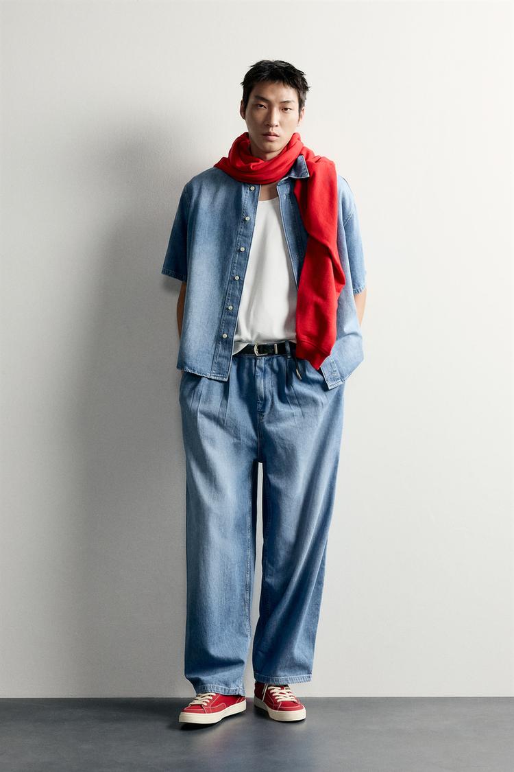 PLEATED DENIM CHINO TROUSERS