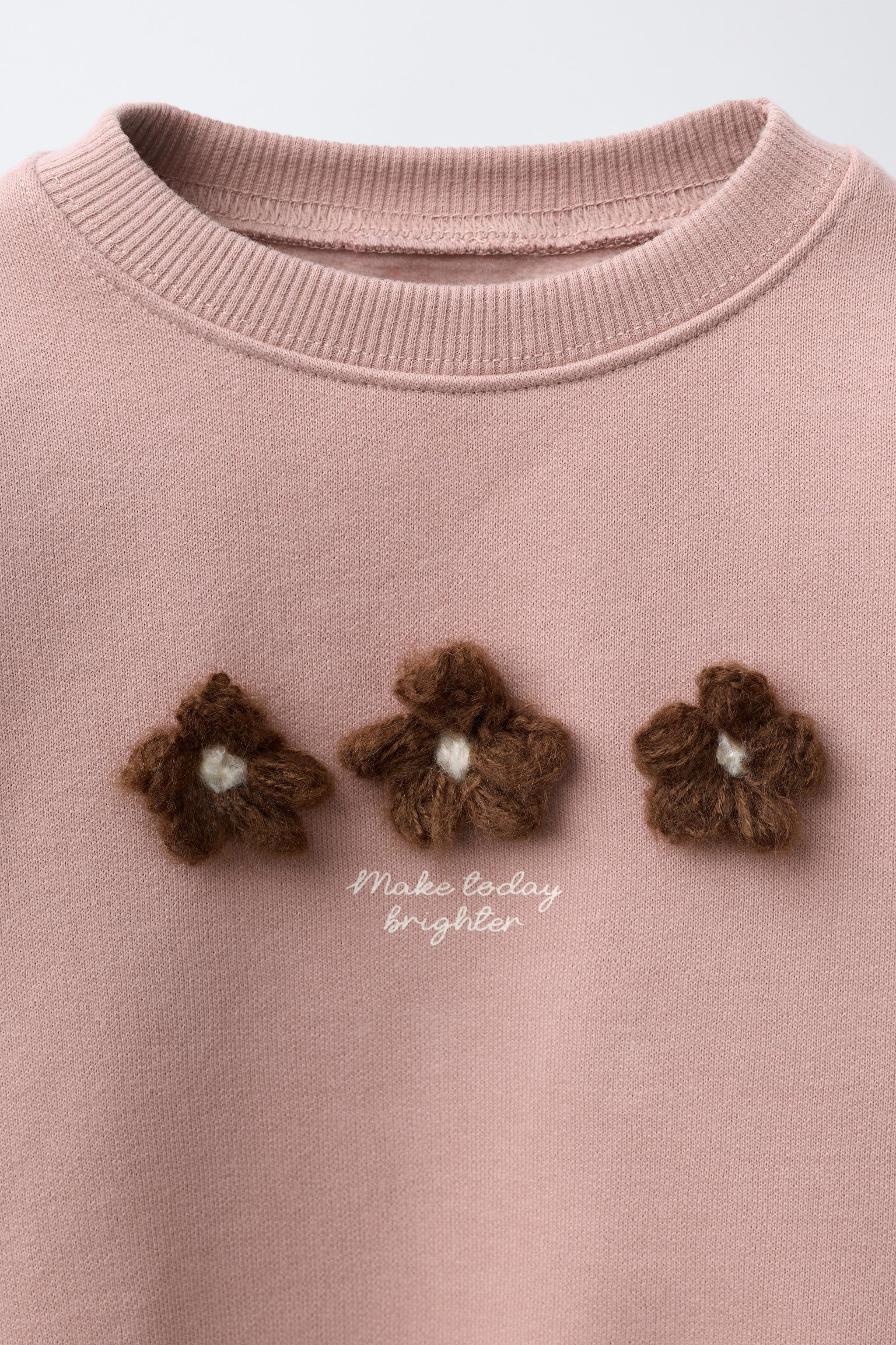CONTRASTING FLORAL SWEATSHIRT