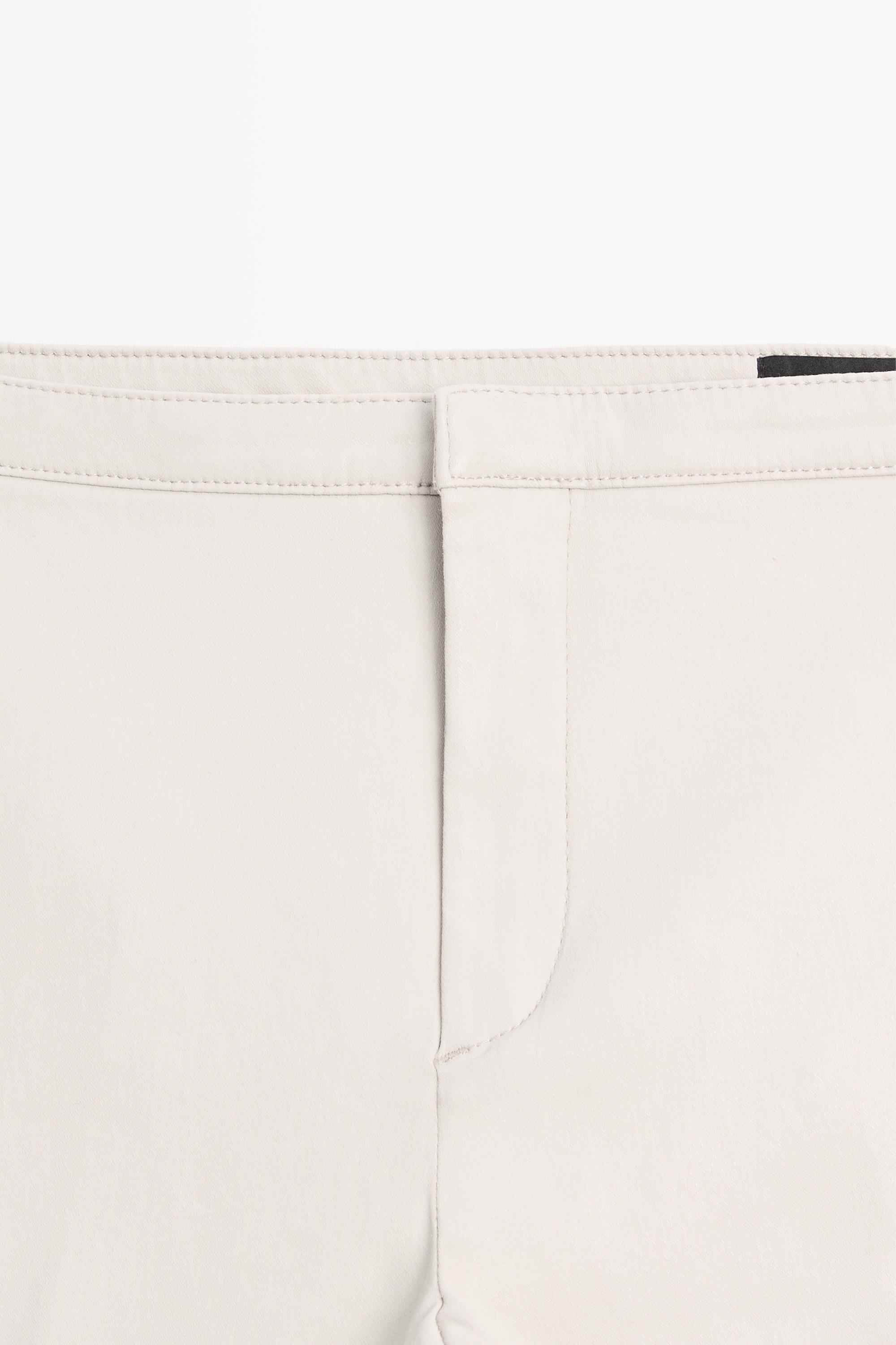 Mid-waist waxed flared pants