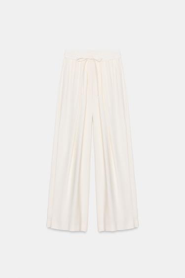 بنطلون منسدل بحافة سفلية قابلة للتعديل - أبيض مكسور الخاص بـ Zara