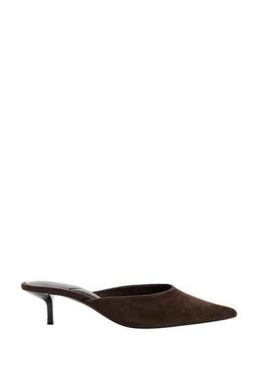 Side view of a dark brown mule shoe with a stiletto heel and pointed toe.