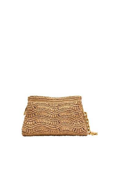 Front view of a beige knit bag with a gold chain.