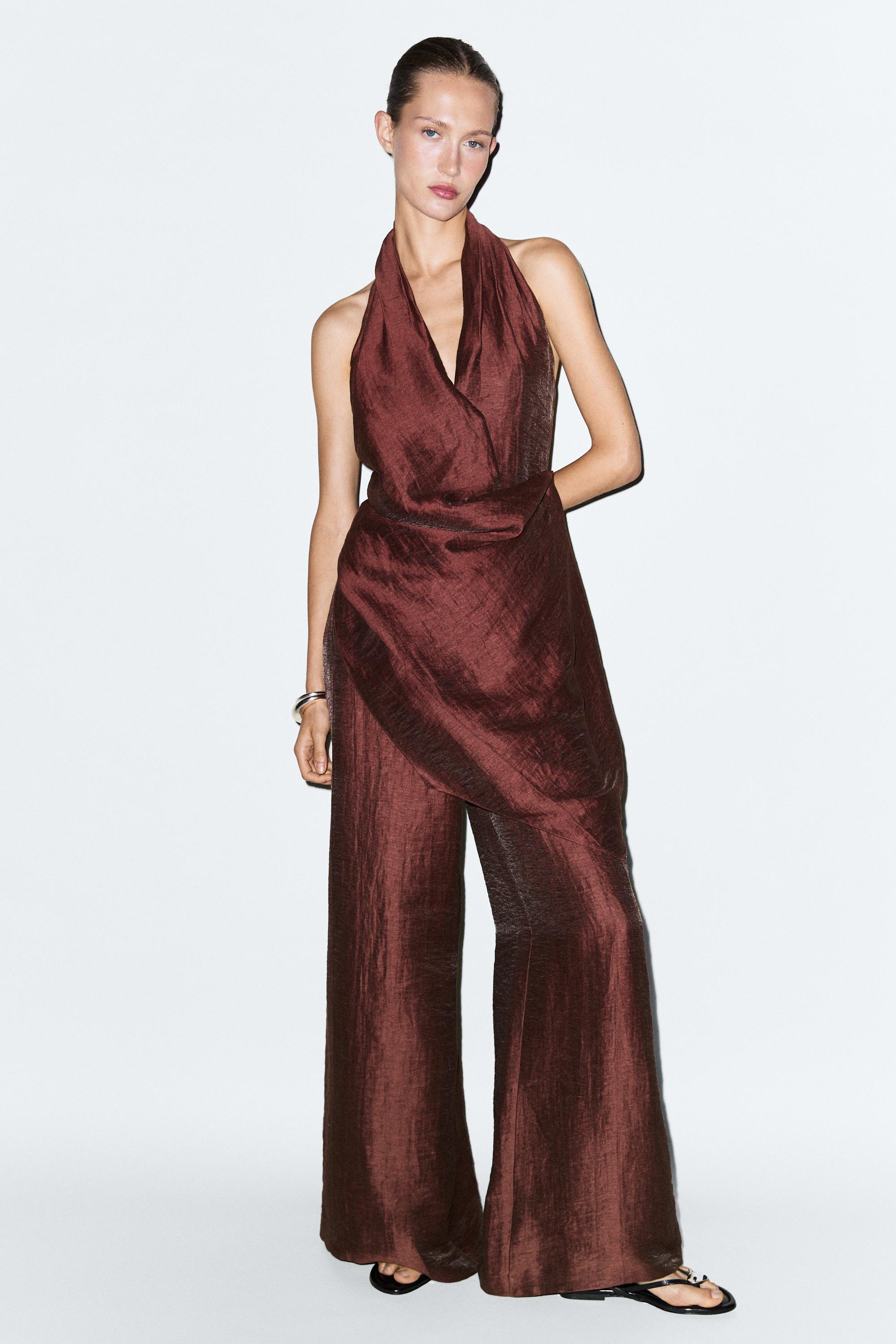 Flowing draped halter neck jumpsuit — white