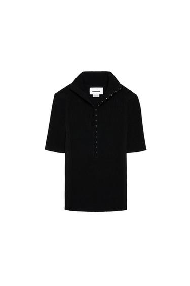 Black short-sleeved jumper with a high neck and buttons down the front. White background. Visible label inside the neck.