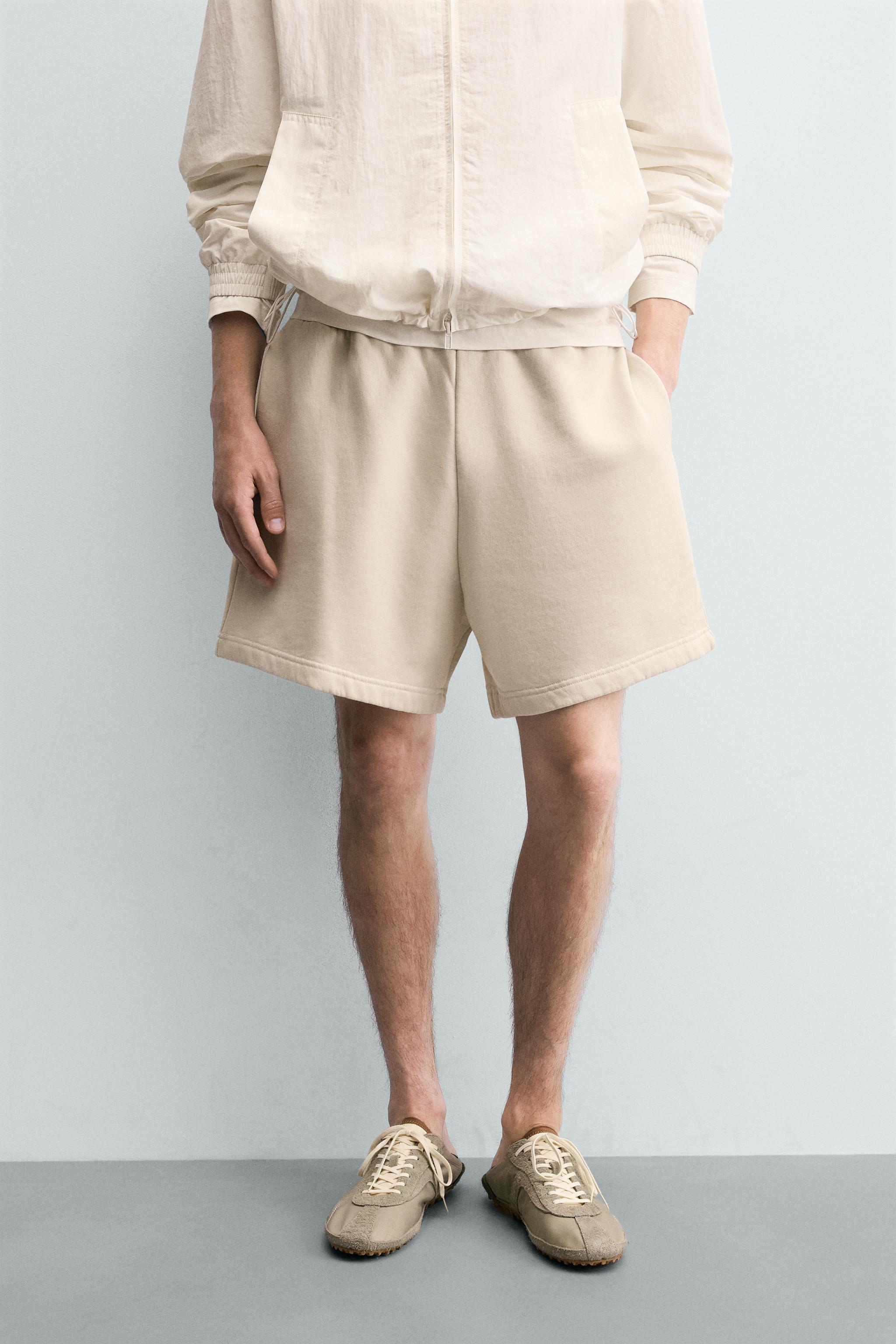 WASHED TEXT PRINT JERSEY BERMUDA SHORTS — Ecru